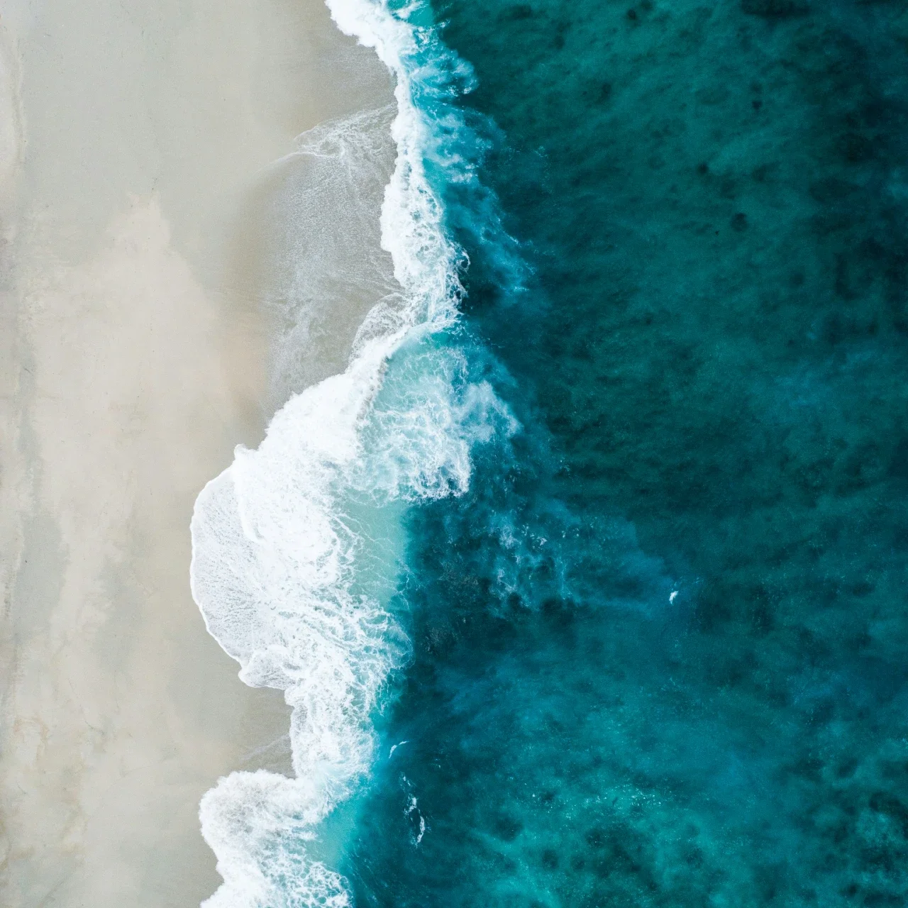 seafoam green waves lapping against the sand | The Witch's Therapist | Emotional Freedom Therapy in London Ontario