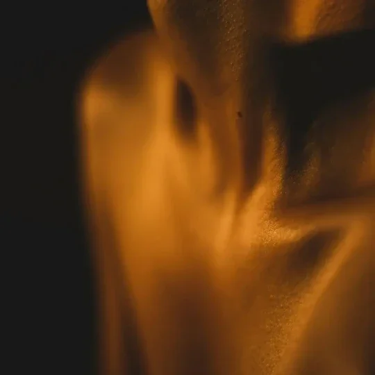 Close-up of a human face with warm lighting, focusing on the nose and surrounding skin | The Witch's Therapist | Holistic Psychotherapy in London Ontario