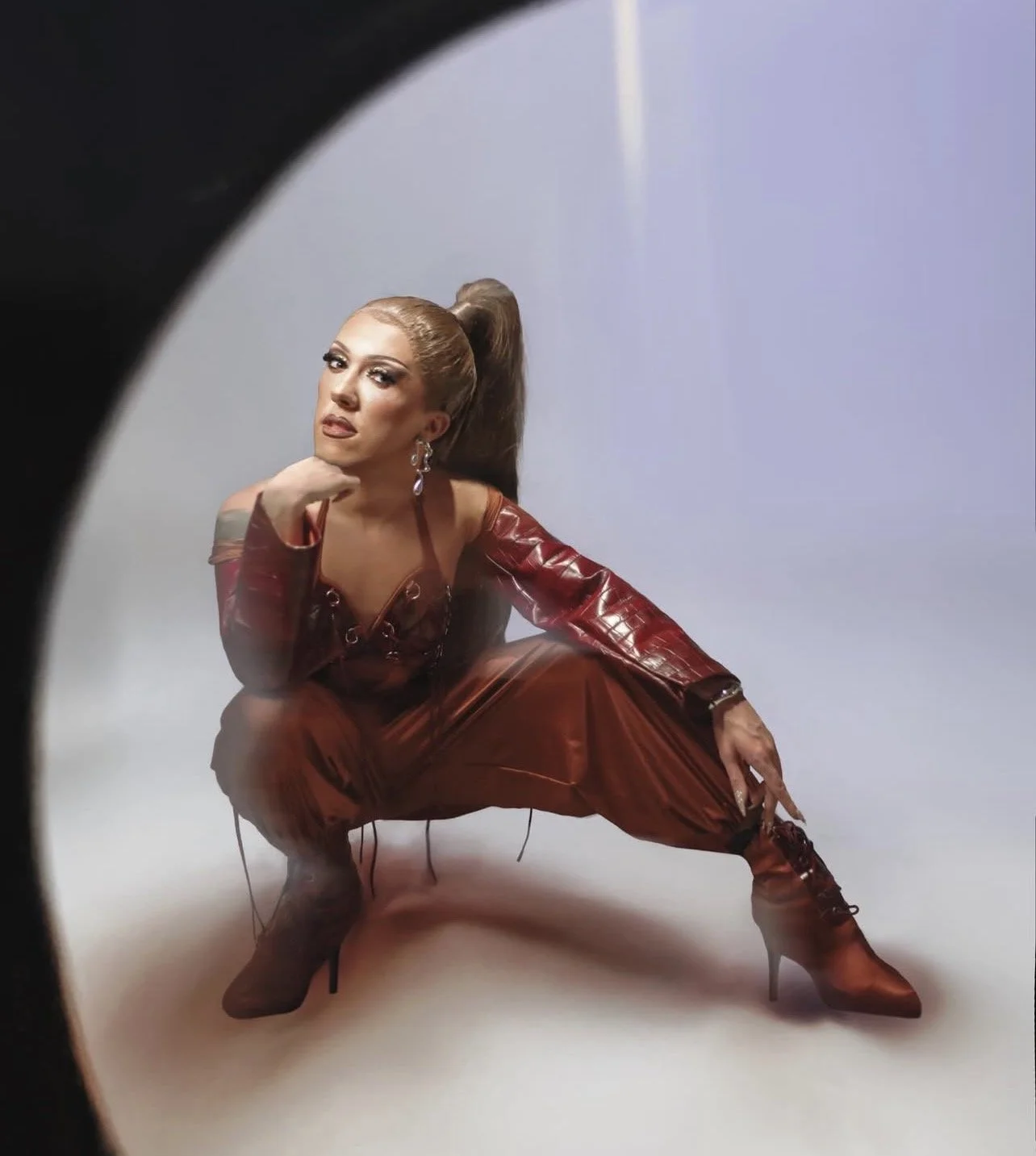 MYA Foxx in custom bodysuit, pants and leather shrug