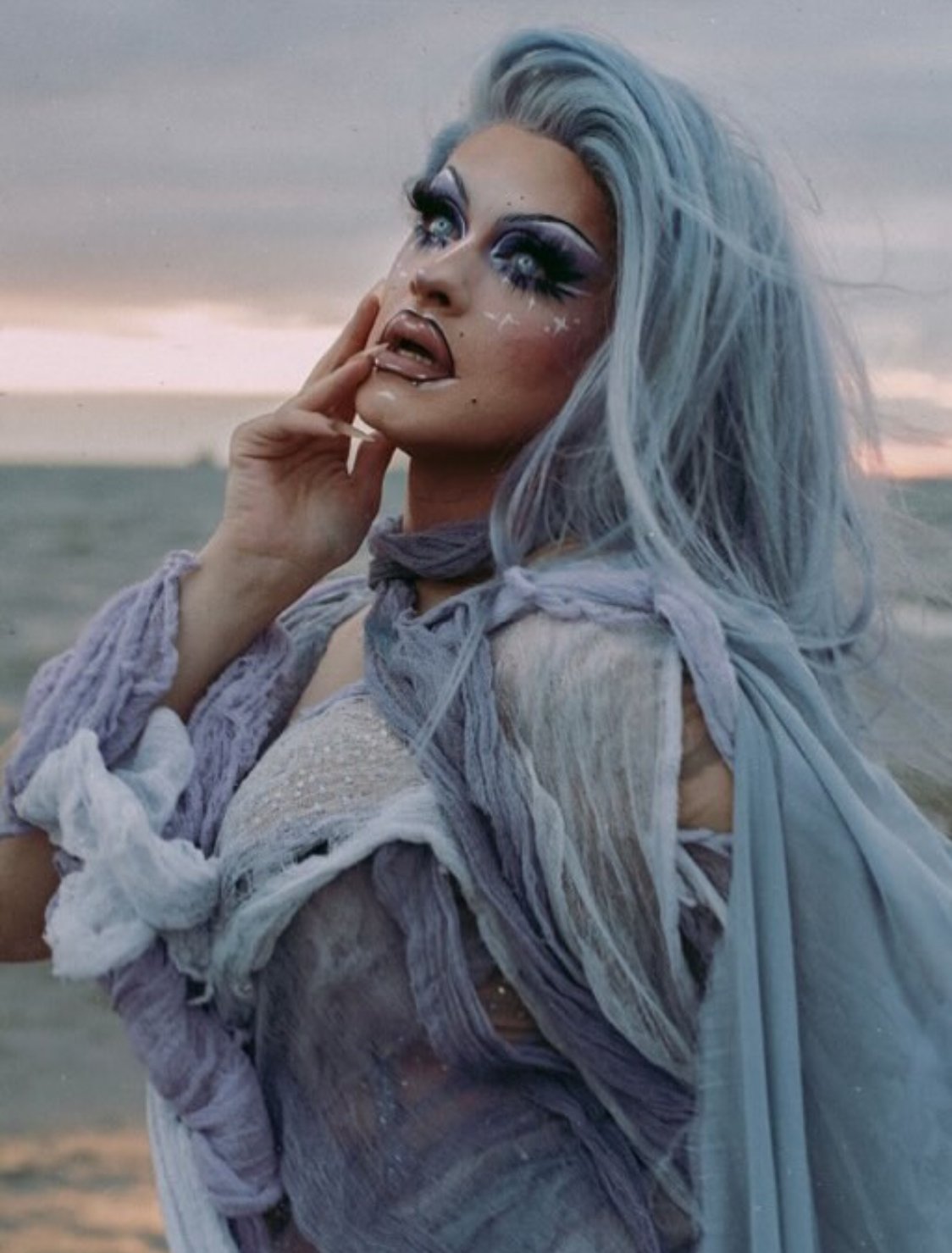 Helena Poison in a layered draped corset gown