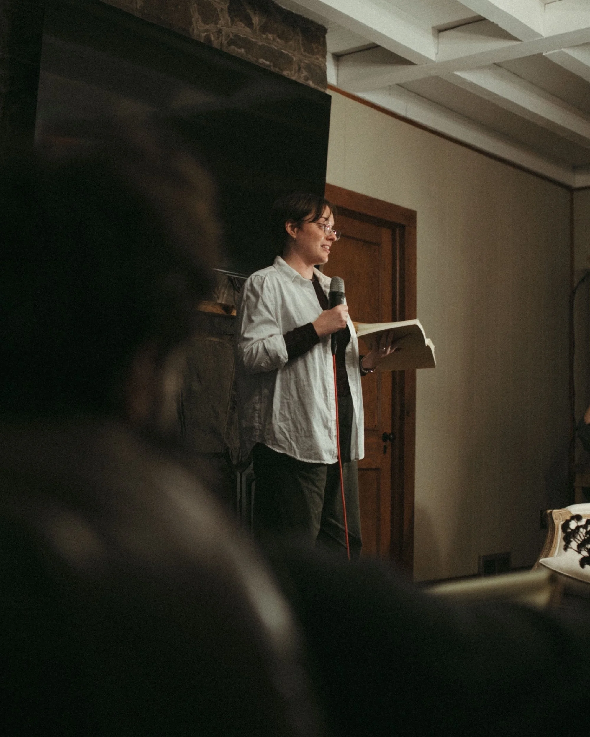 A visiting literary agent references her notes during her keynote lecture at the Gilliam Writers Group retreat.
