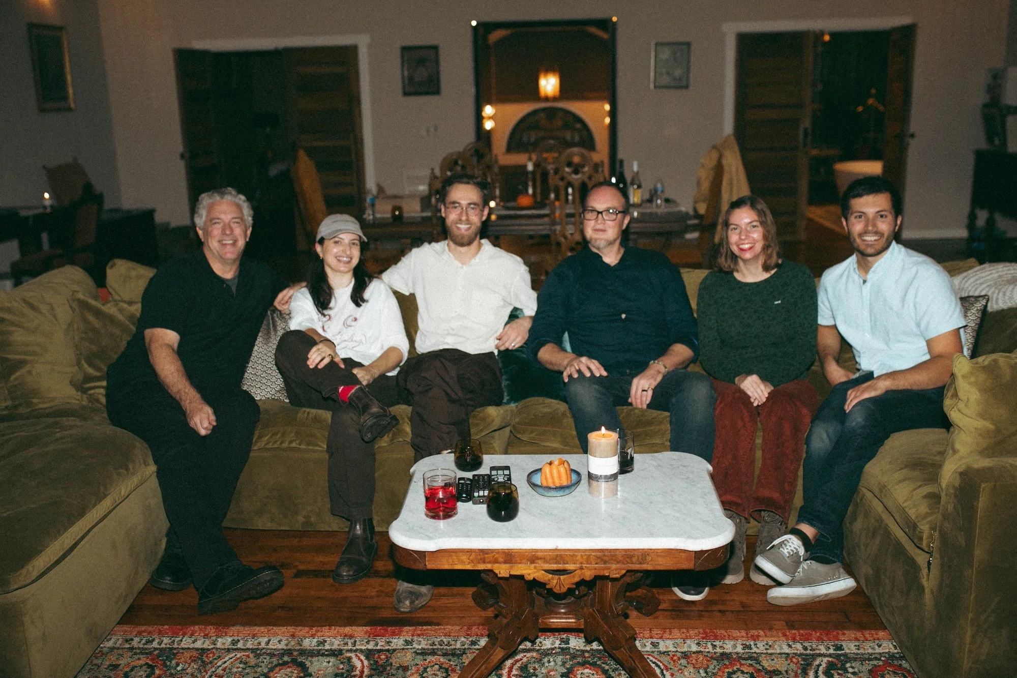 Six Gilliam Writers Group faculty gathered for a group portrait at a company event.