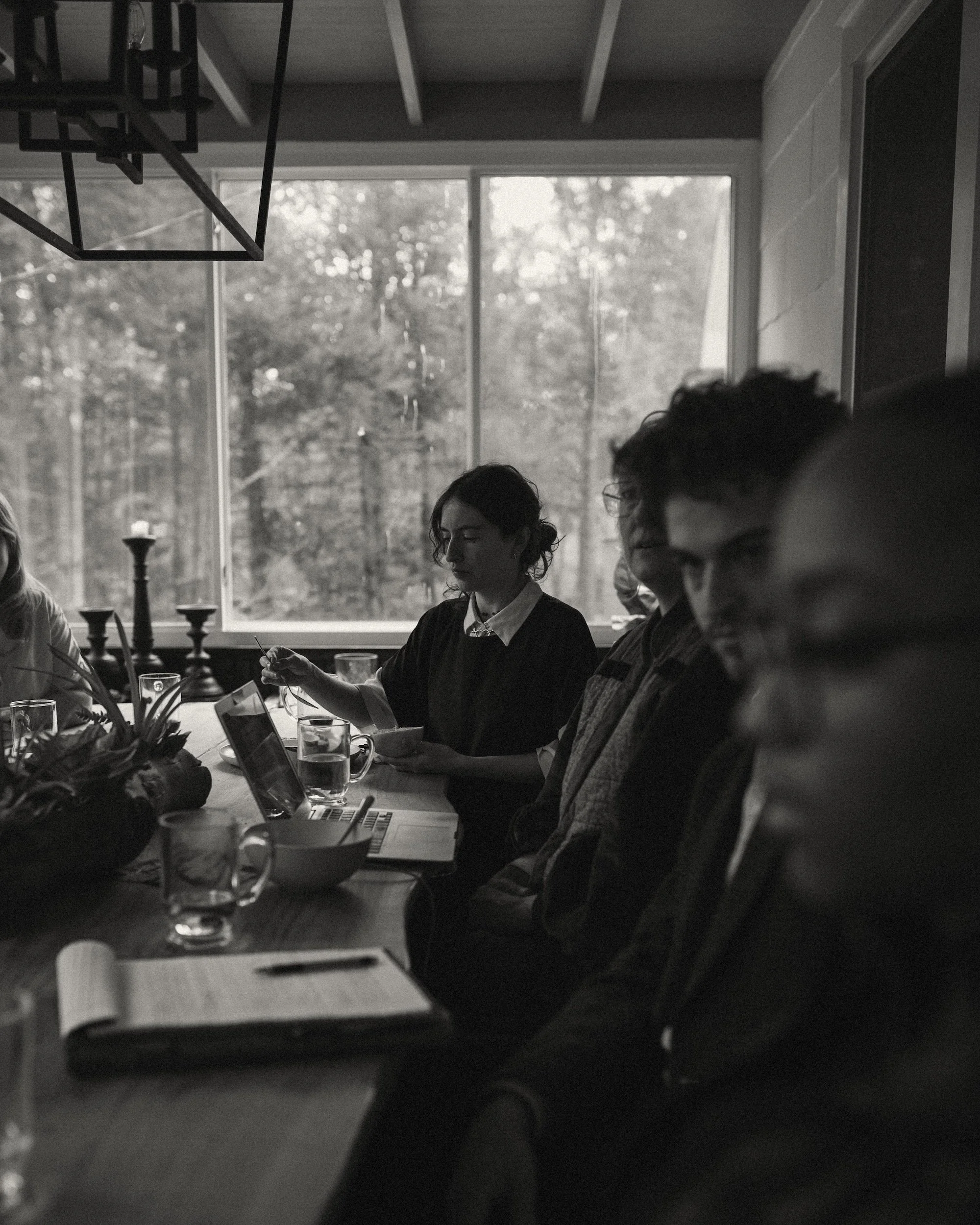 GWG faculty members review their notes during a busy workshop session at the company retreat.