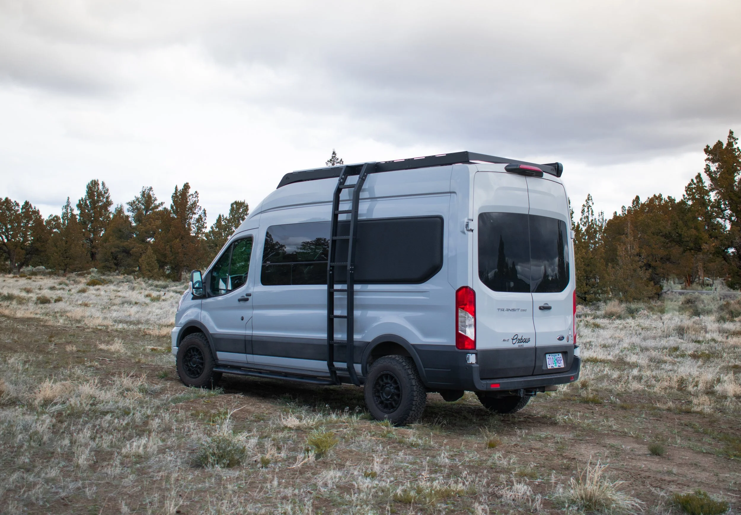 Custom Ford Transit camper van for sale – built by Oxbow Vans in Bend, Oregon. Featuring side mount ladder