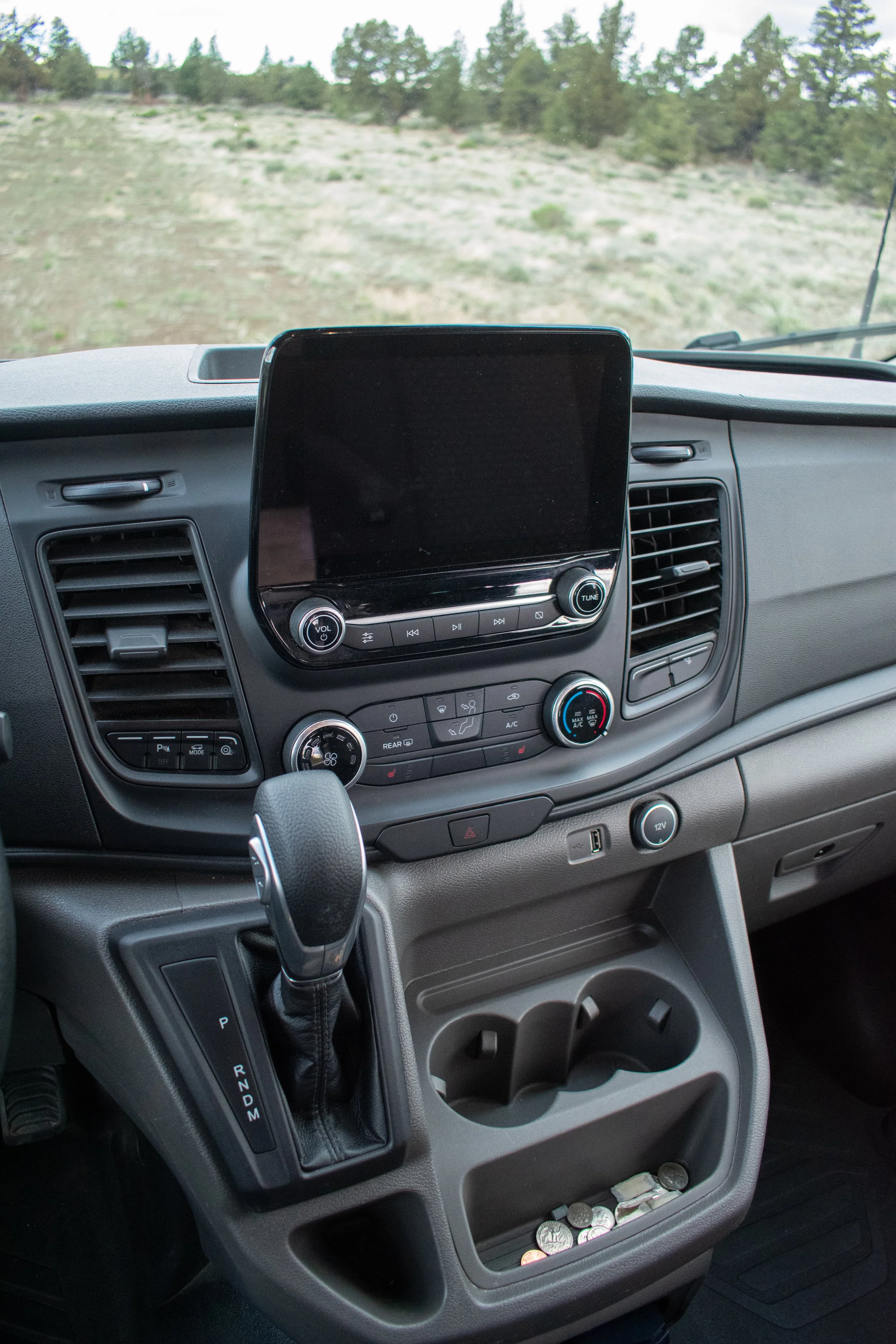 Ford Transit camper van cab with modern dash amenities – Oxbow Vans build