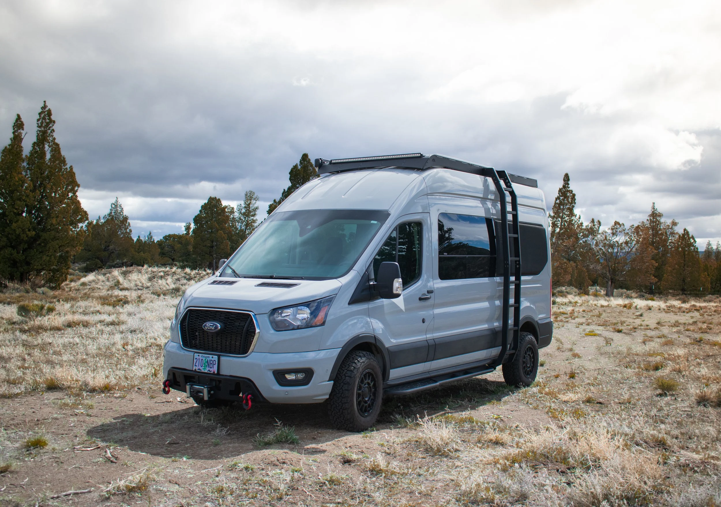 Custom Ford Transit camper van for sale – built by Oxbow Vans in Bend, Oregon. Featuring side mount ladder