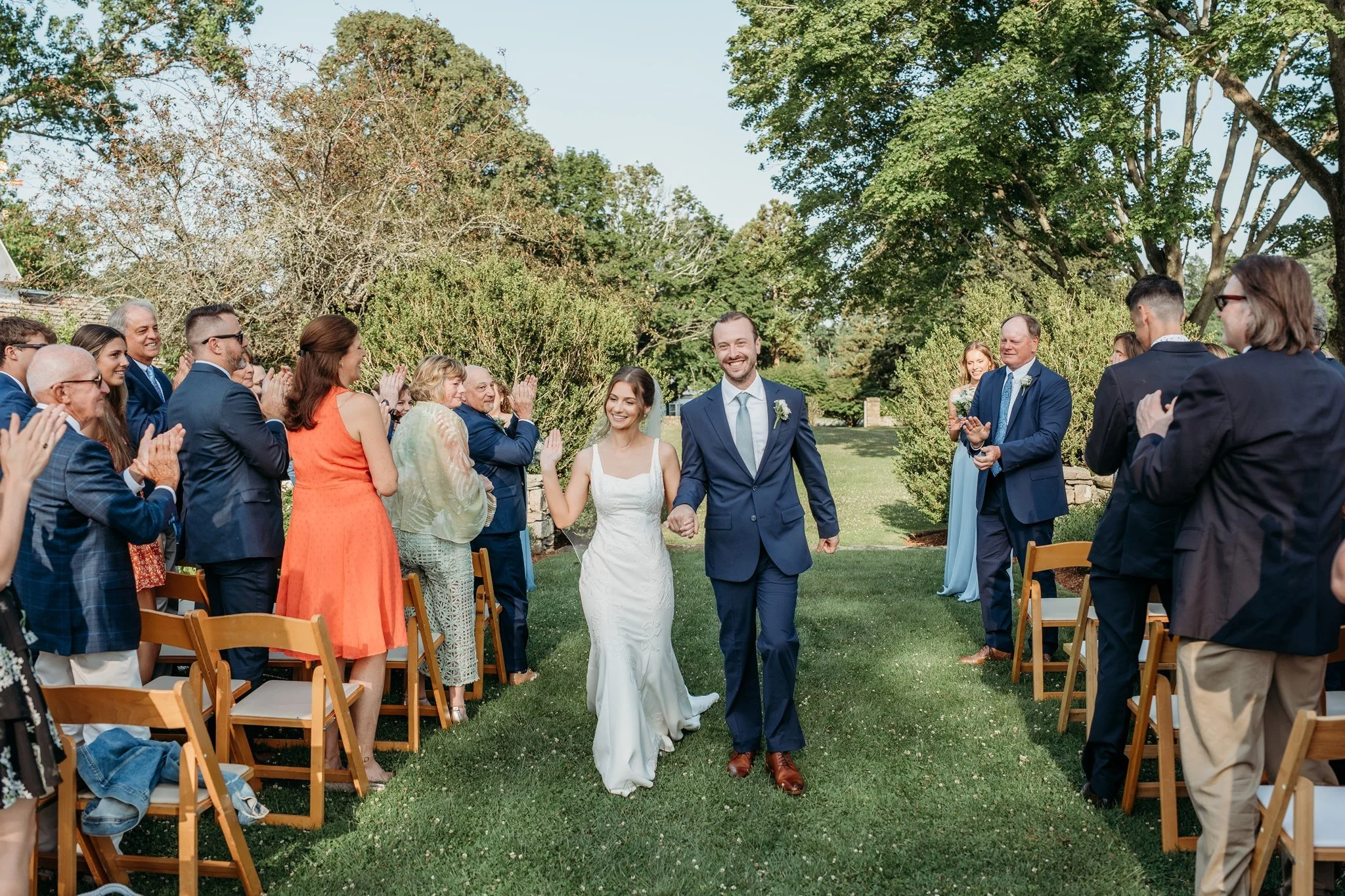 wedding ceremony in historic gardens at coastal wedding venue