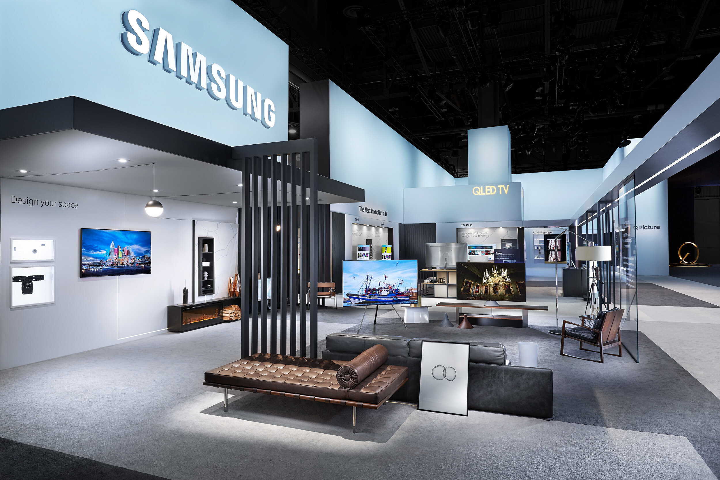 Wide-angle view of the smart living room design inside Samsung exhibit booth at CES conference in Las Vegas.