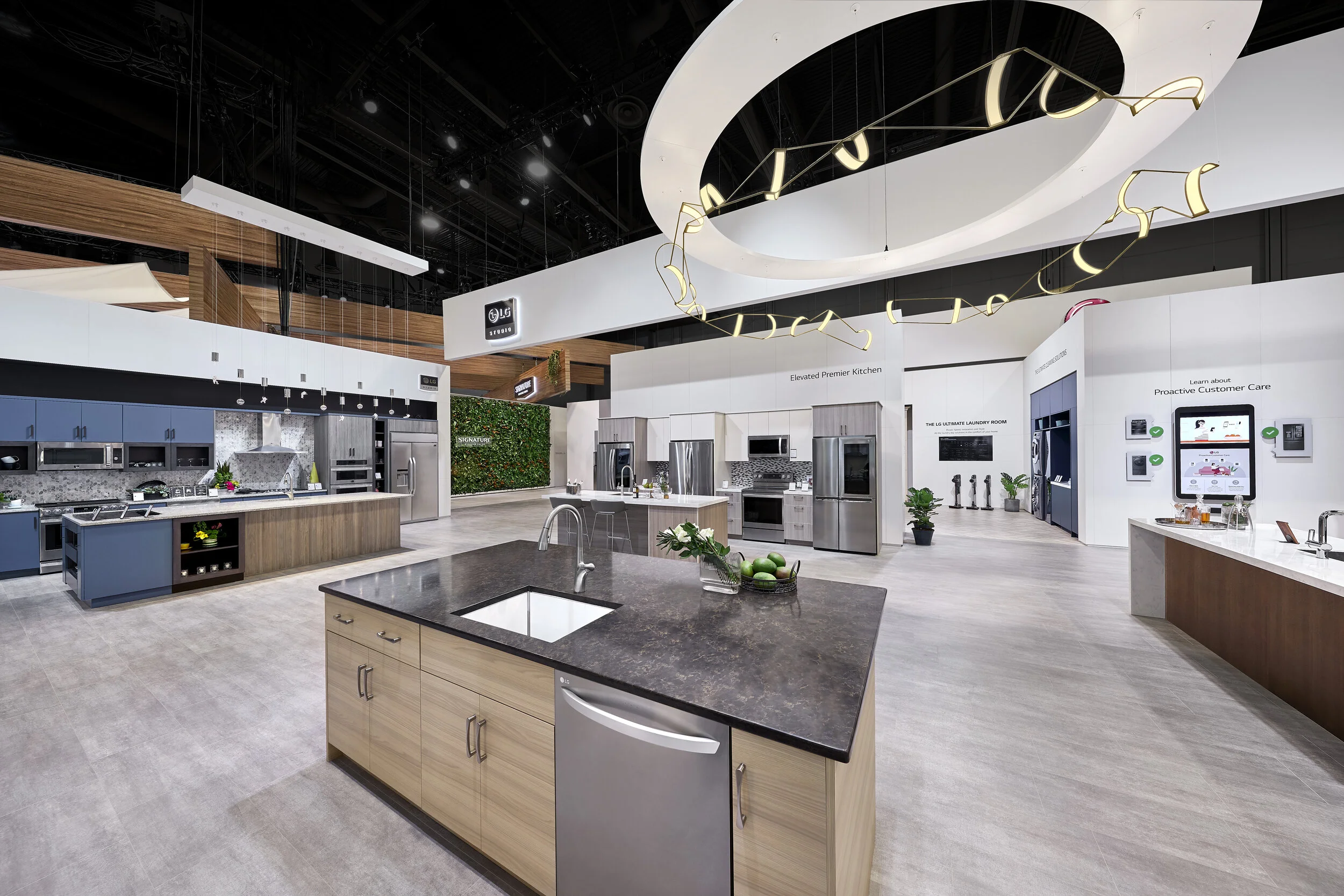 LG Signature tradeshow booth at KBIS conference in Las Vegas showcasing smart stainless steel appliances and contemporary kitchen design. 