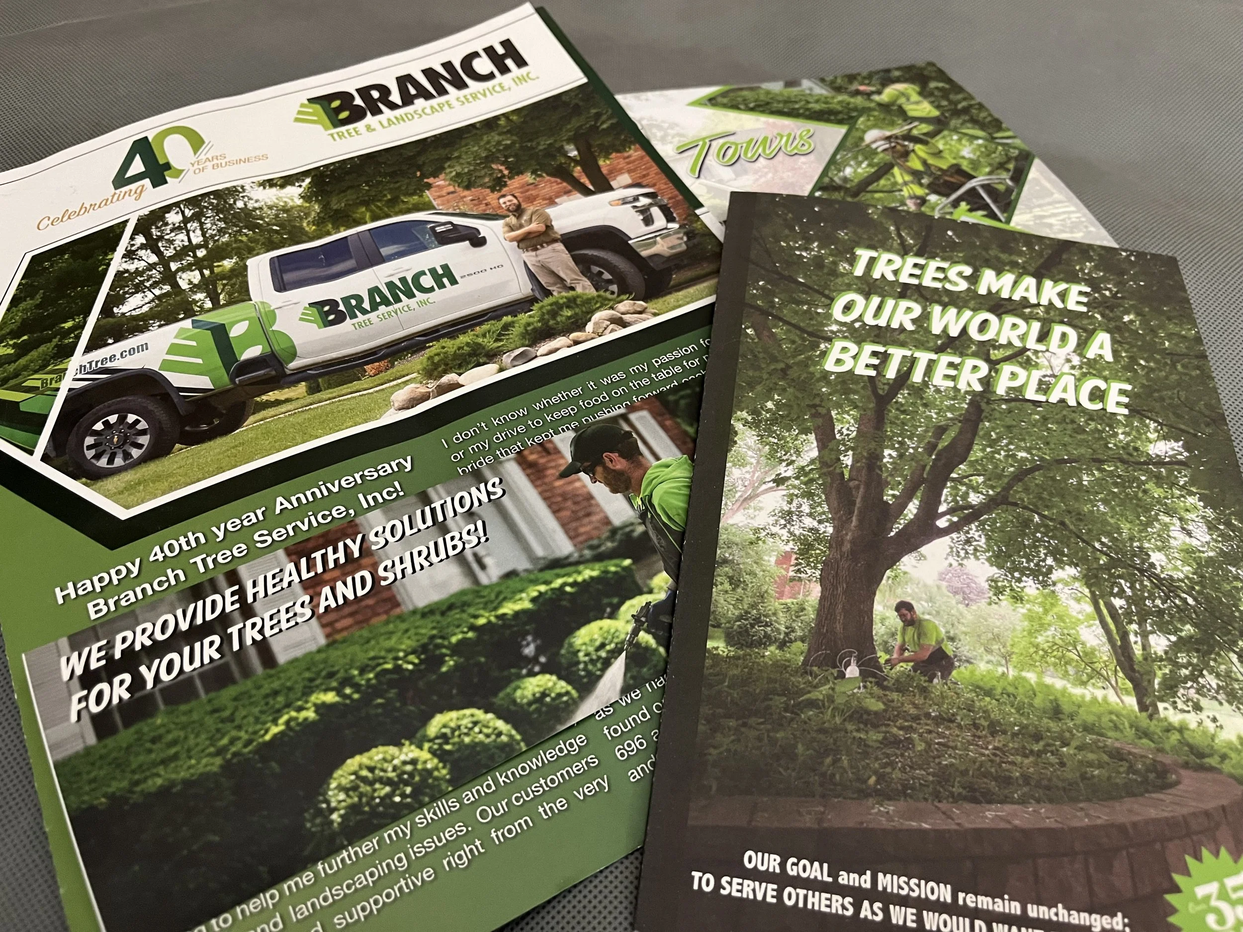 Brochure and flyer for Branch Tree Service, Inc. featuring images of a company truck branded with the company's logo, a tree planting scene, and landscape gardening. The brochure celebrates the company's 40th year and emphasizes health solutions for trees and shrubs, with a focus on making the world a better place.
