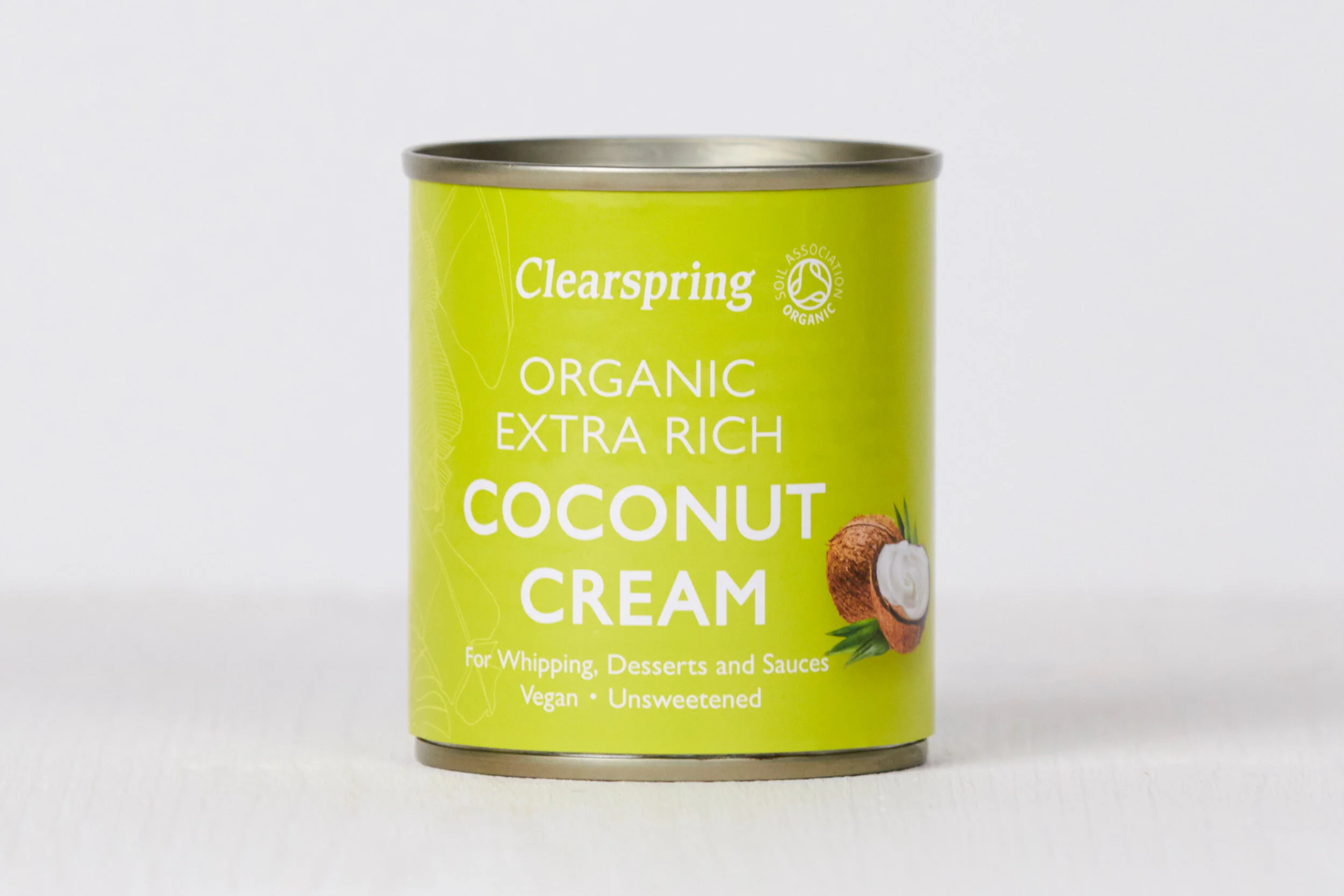 Green can of Clearspring organic extra rich coconut cream with a picture of a halved coconut on the label.