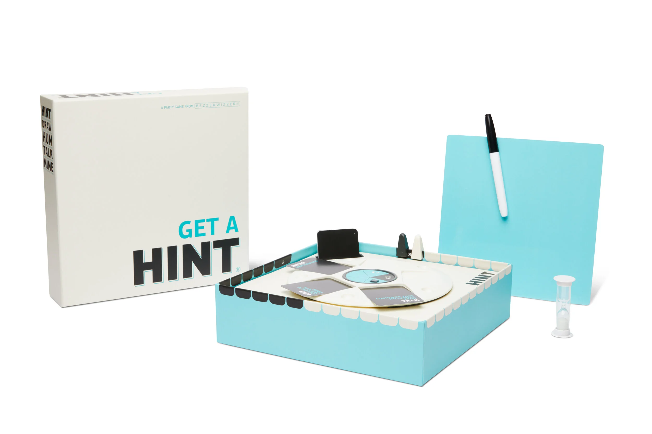 A board game set called 'Get a Hint' includes game pieces, cards, a small hourglass, a dry erase board with a marker, and a game box with the title 'Get a Hint' in bold letters.