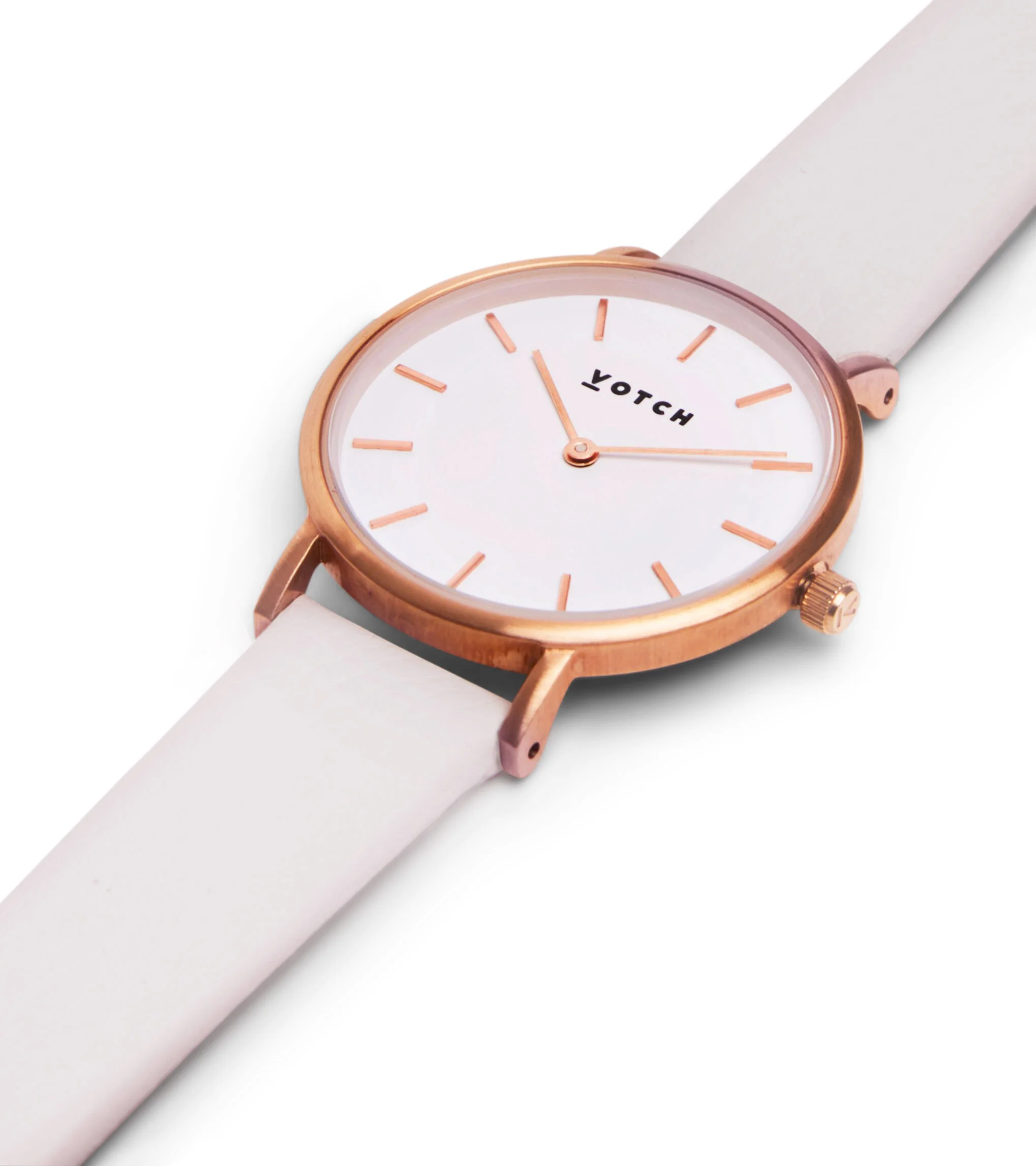 A women's wristwatch with a rose gold case, white face, and white strap, displaying the time at approximately 11:14.