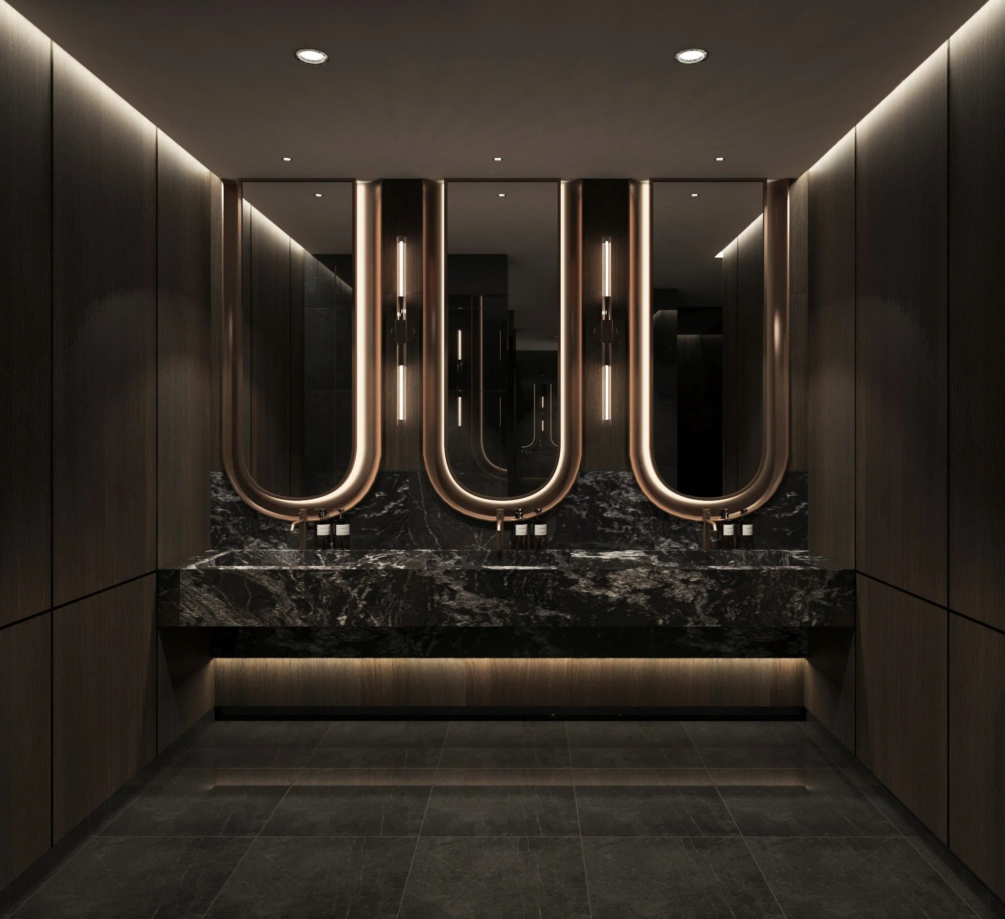 Upscale men's restroom with three black marble sinks, illuminated mirrors, dark wood paneling, and dim ambient lighting.