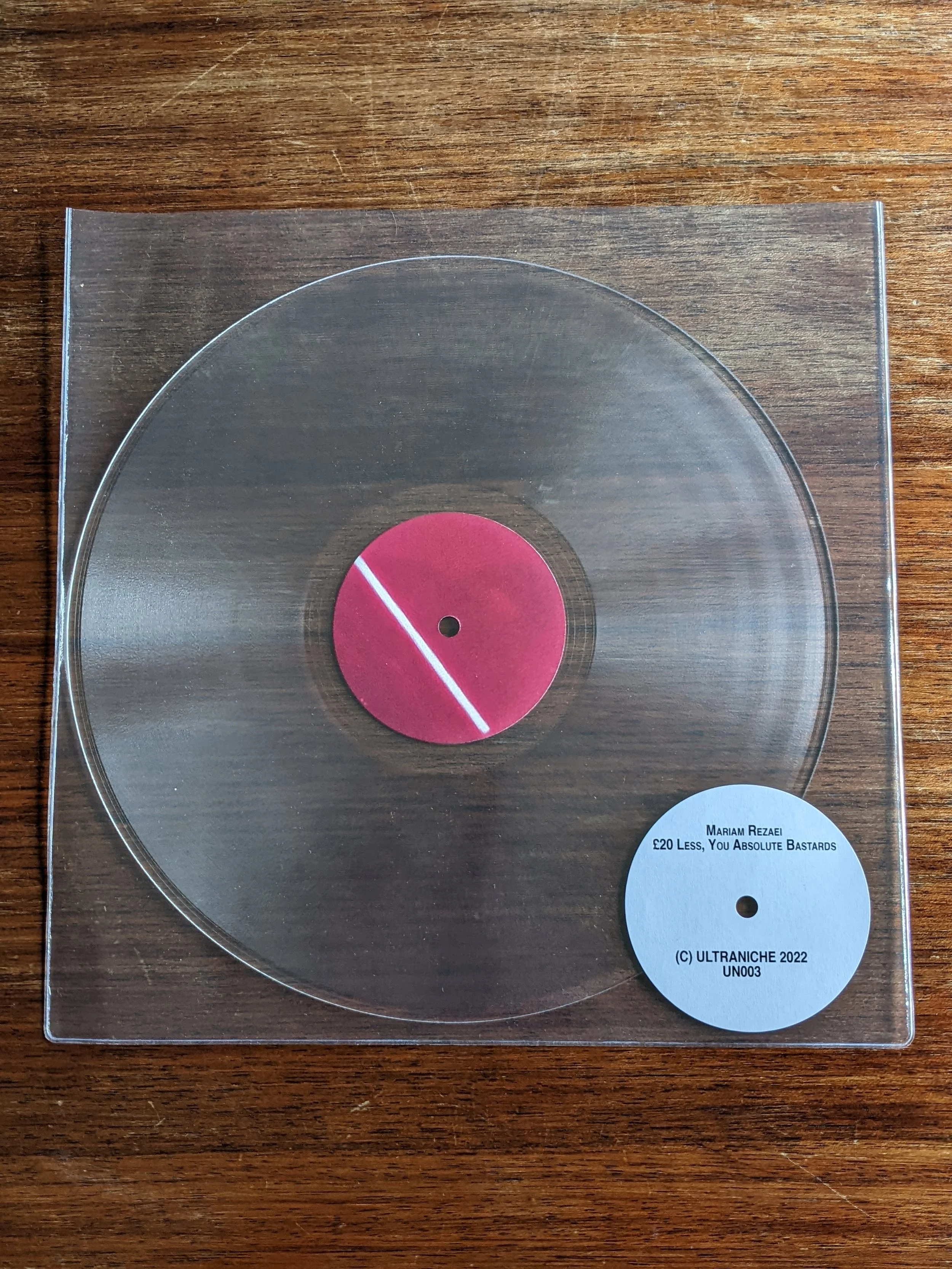 rezaei clear vinyl with red label