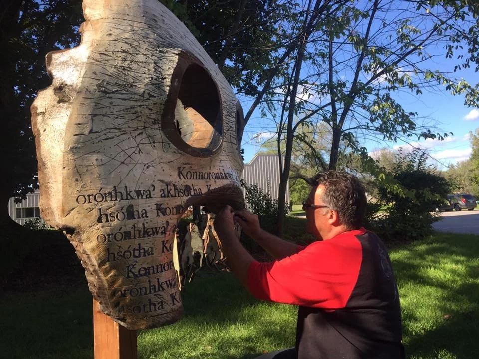 Putting the finishing touches on Taker.
Installed in front of the Mohawk Institute in Brantford, Ontario—Canada’s oldest residential school—this sculpture was created as part of the Mush Hole Project. My grandmother, Gramma B, attended the residentia