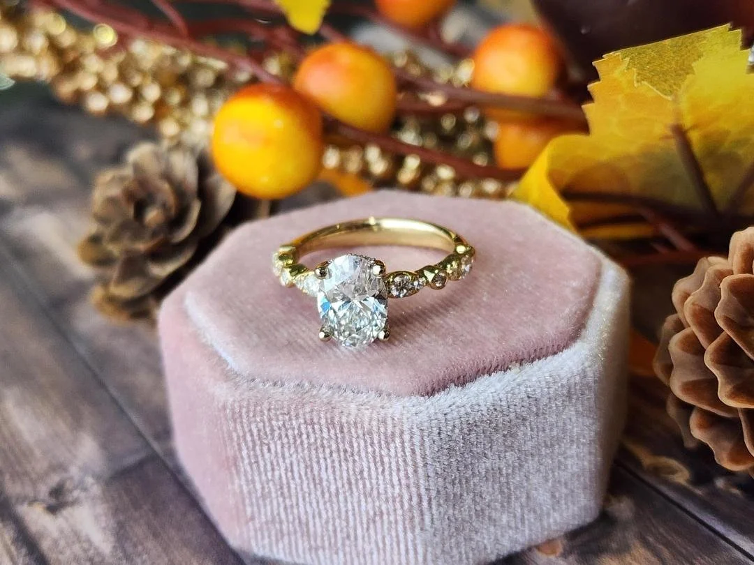 One ring on pink box with fall decor in background