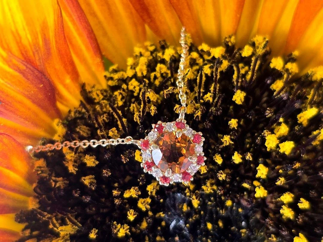 Angled view of a stationary citrine necklace on sunflower background