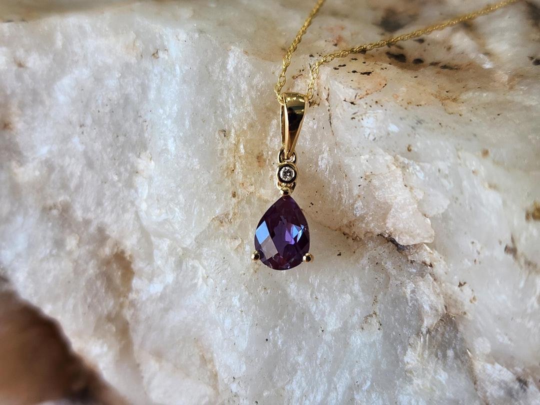 created alexandrite necklace with diamond accent on white quartz