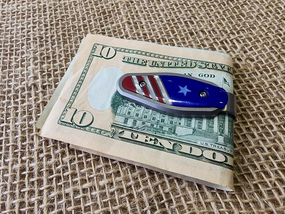 One patriotic style money clip with money in clip on burlap