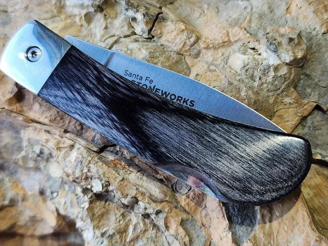 3" knife with stabilized birch on rock