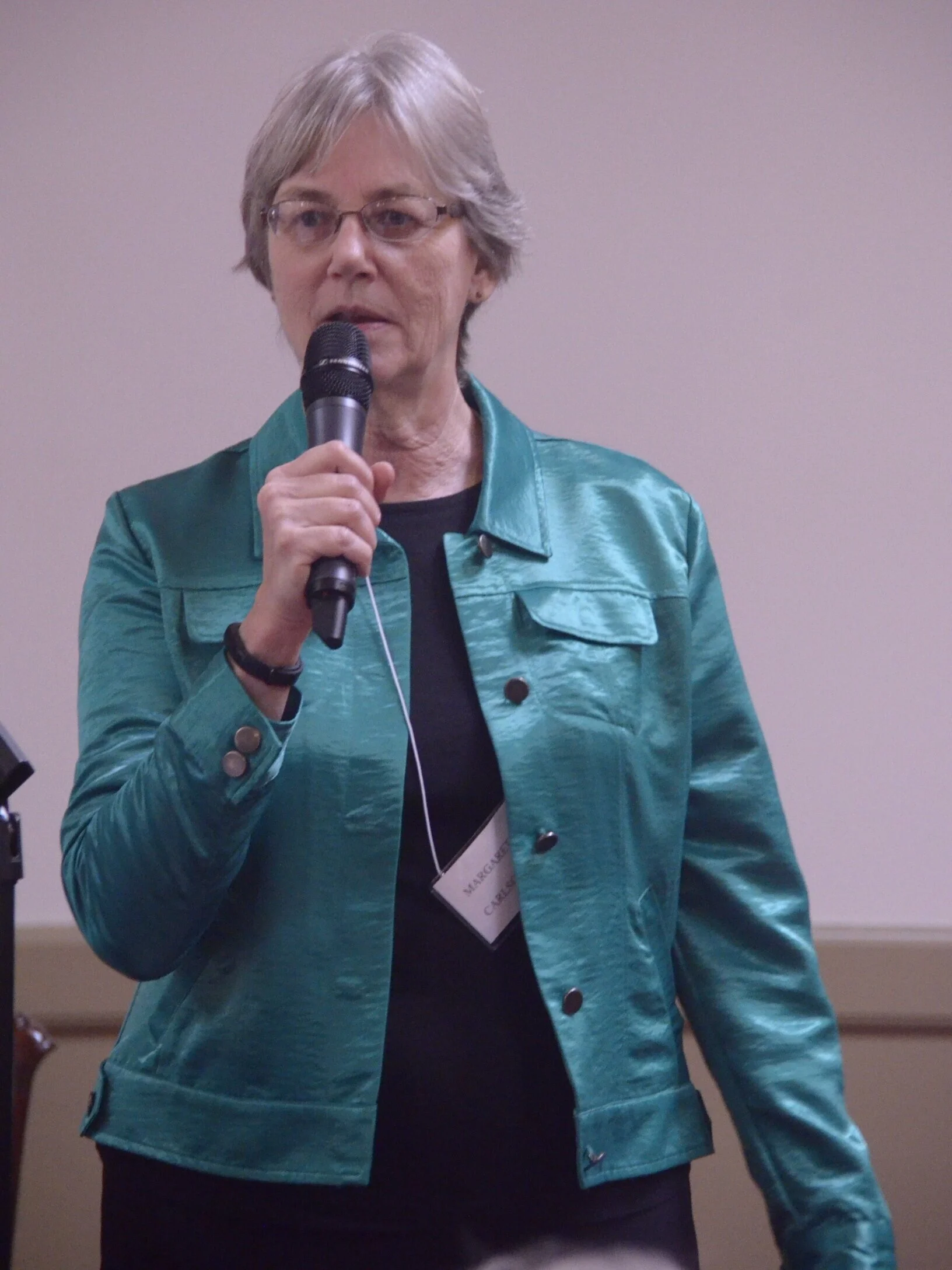 Margaret Carlson, Second VP Programs, introduces Tidewater Guitar Quartet