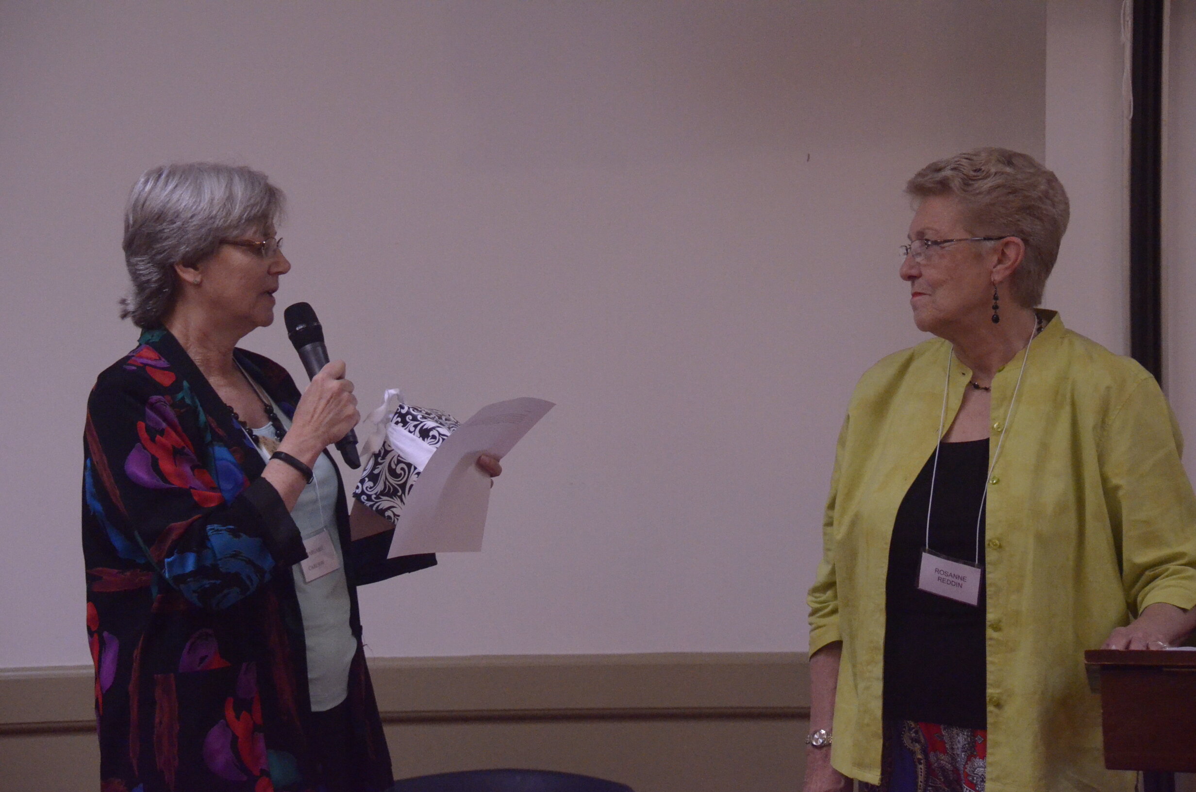 Margaret Carlson thanks Rosanne Reddin, 2014-2016 President, for her service to WMC