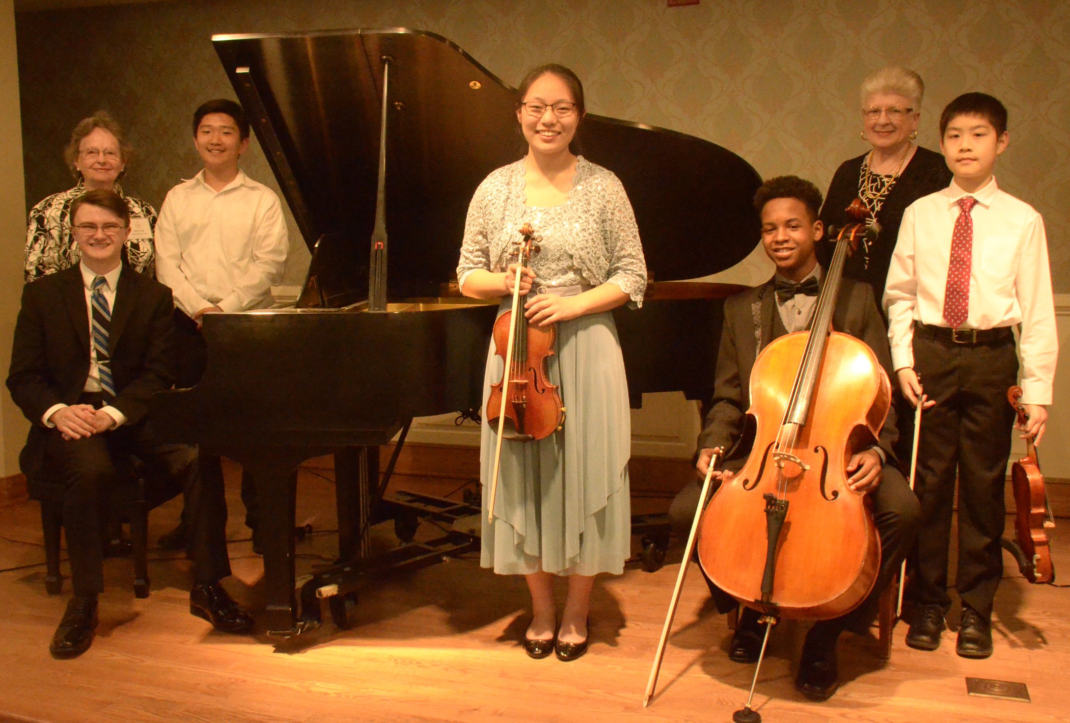 April 24th SB Recital at Williamsburg Landing:  (L to R)  Paul Overlie (seated); Sylvia Lynn, SB Chair; Eric Song, Yunseo Chung; Brelan Jenkins (seated); Donna Herman, President; Matthew Fan