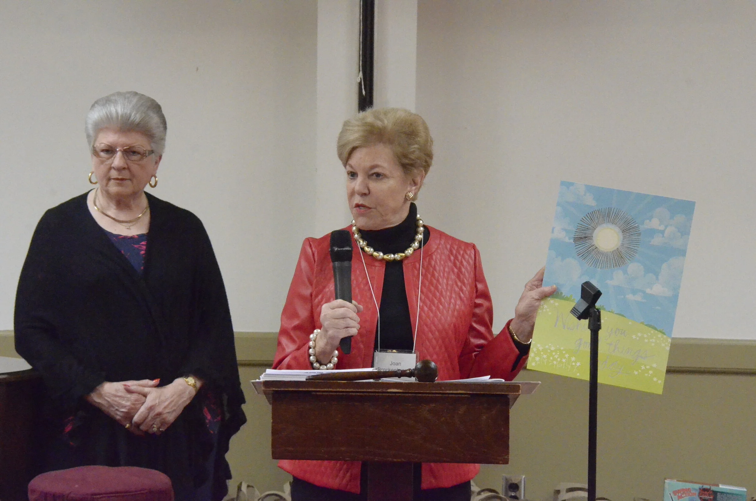 Joan Brockenbrough, Corresponding Secretary, invites members to sign get well card for Kathy Exton