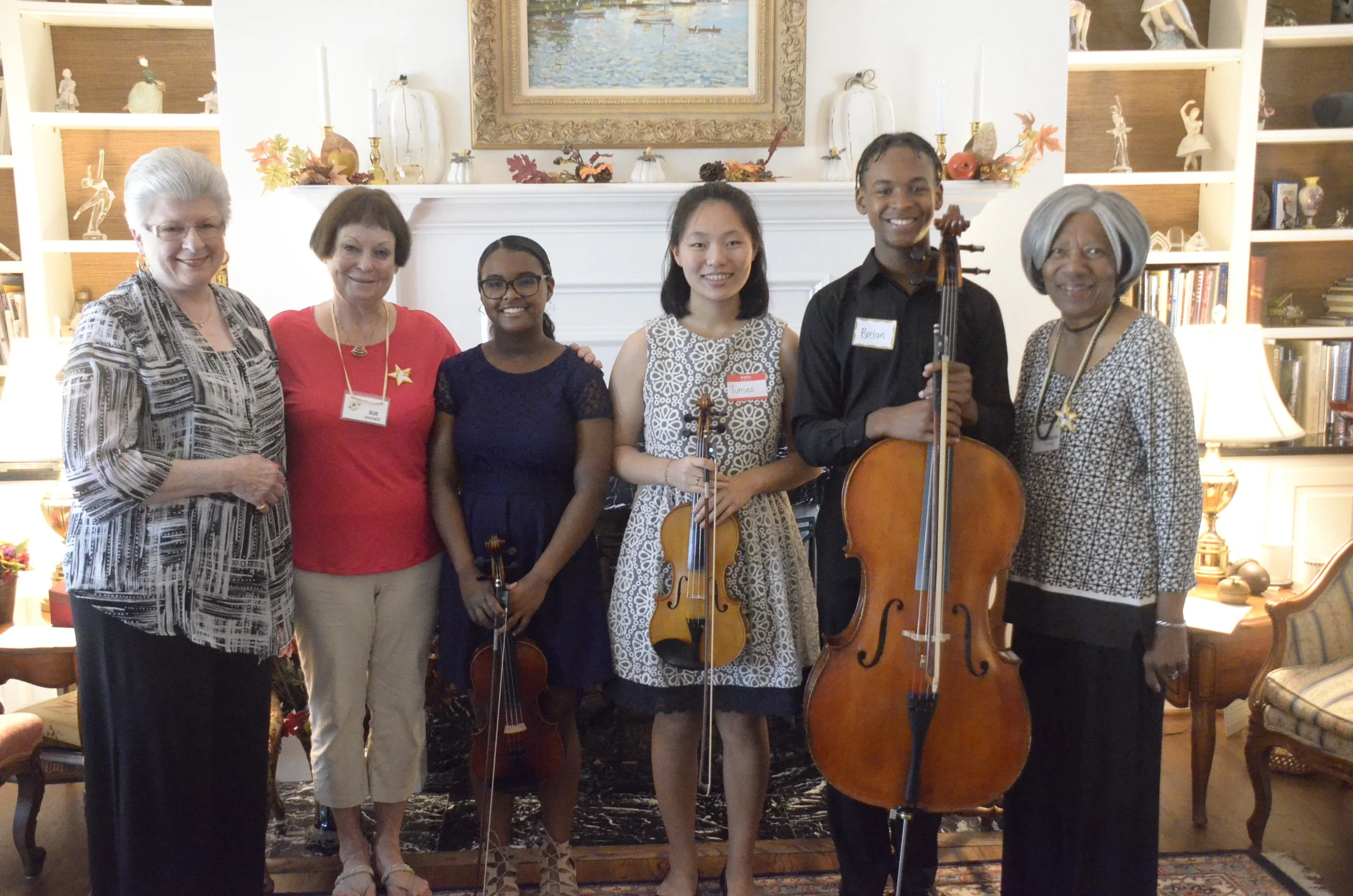 L to R:  Donna Herman, WMC President; Sue Wagner, Hostess; Sydney, Yunseo and Brelan; Barbara Haynes, PEO Program Chair and WMC member