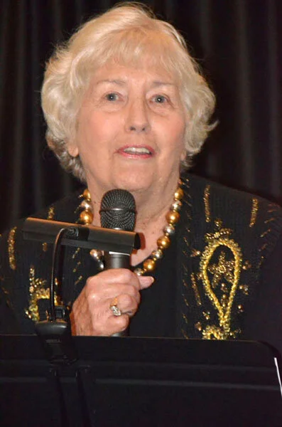 Kathy Exton, 1971-72 and 1982-1983 WMC President, accepts thanks