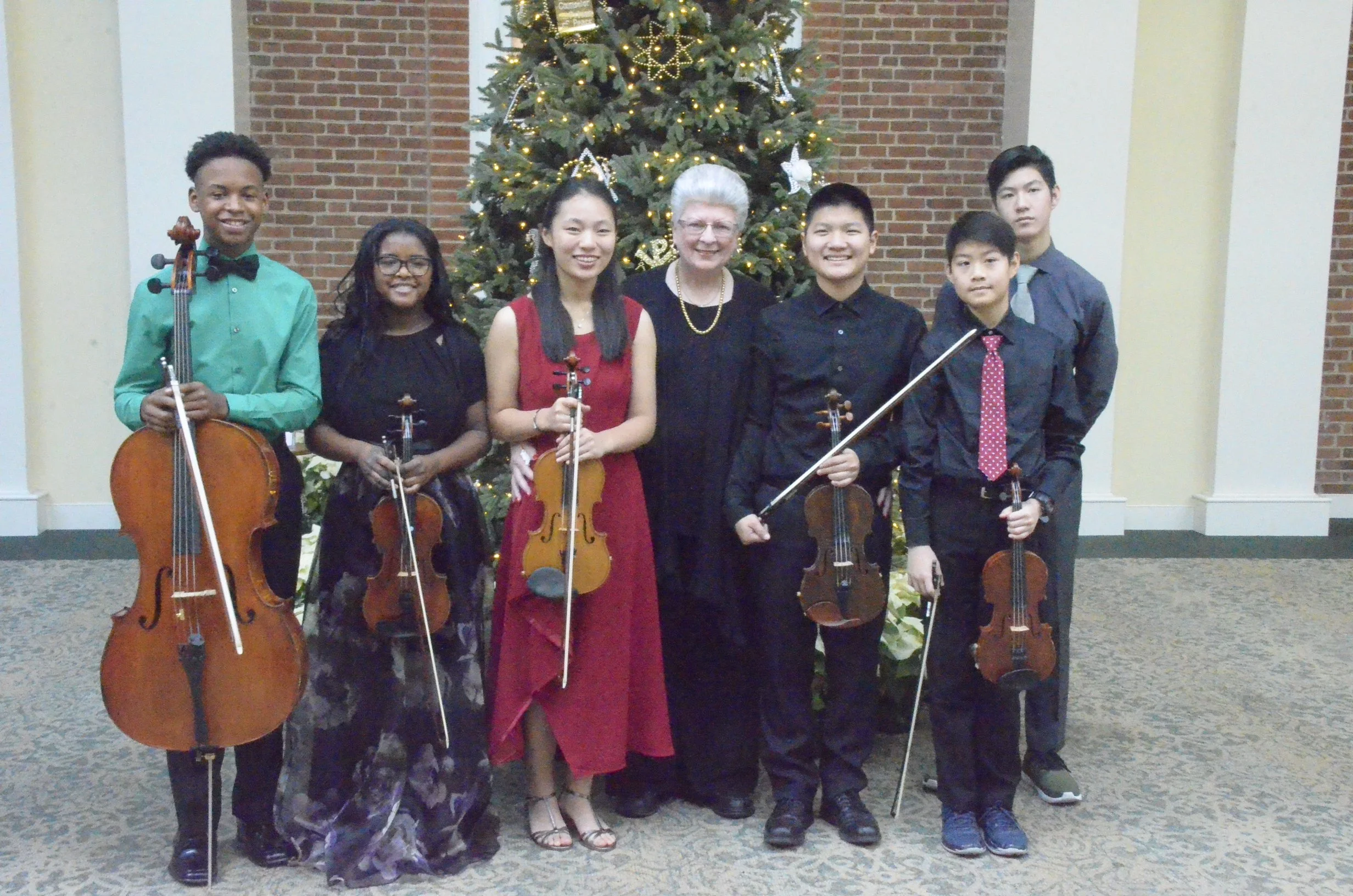 The students:  Yunseo, Brelan, Anna, Caleb, Eddie and Elizabeth, with Donna Herman, President