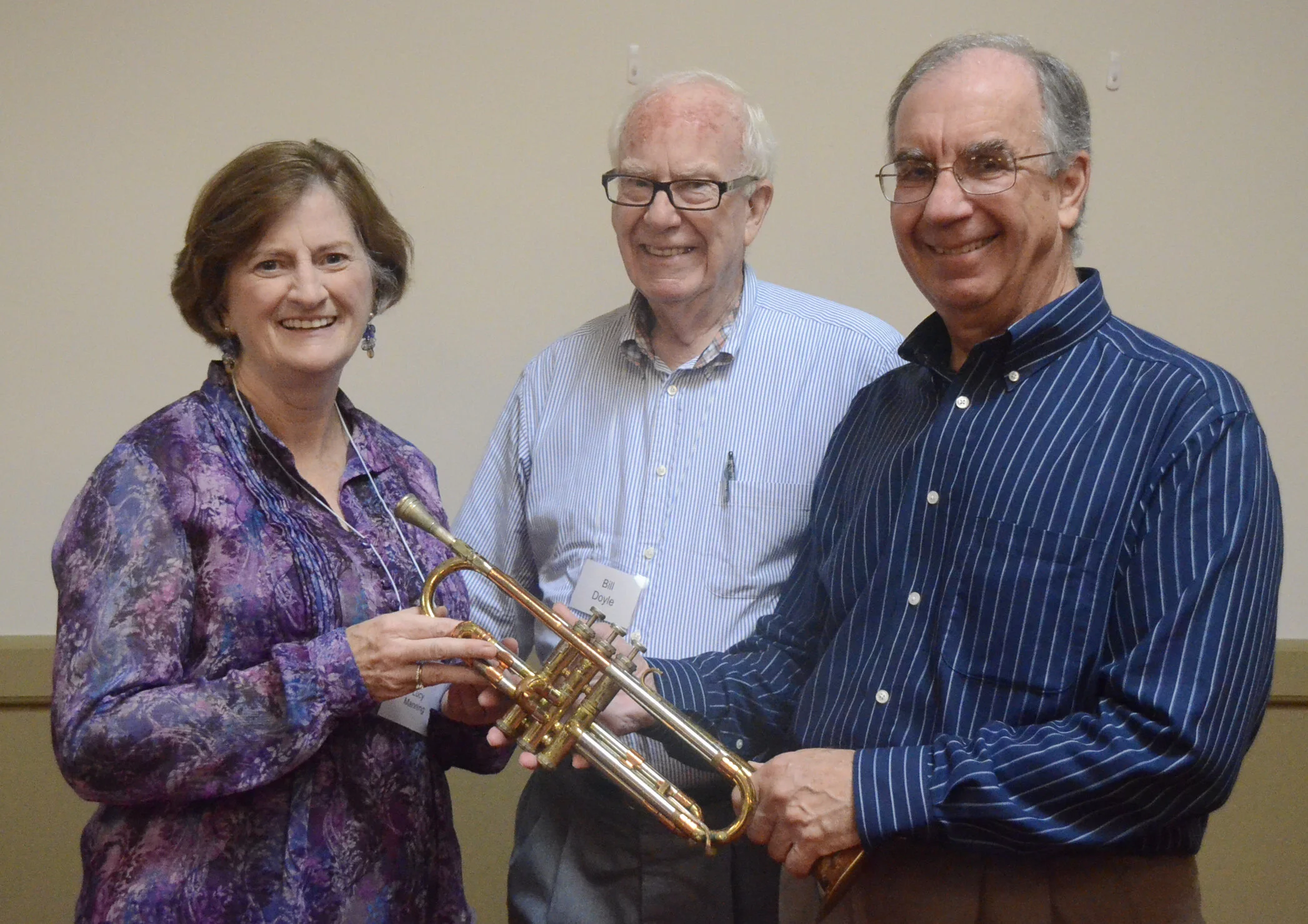 Bill Herman donates trumpet to "LIKE" Program:   Lonely Instruments for Kids; accepting trumpet are Lucy Manning, WSO VP:  Education; and BIll Doyle, WMC Second VP:  Membership