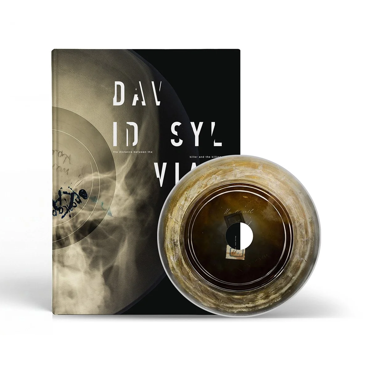 Pre-Order: David Sylvian – ‘The Distance Between the Killing and the Killer‘ (Indies only limited edition CD Packaged in a 155mm x 208mm case bound 12-page book)