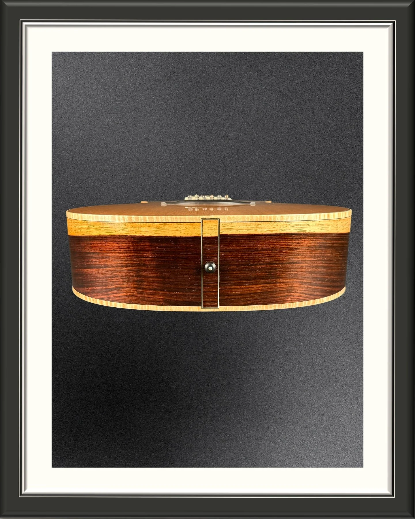 The end graft of the ECA custom acoustic guitar with Western Red Cedar top and Nicaraguan Rosewood back and sides