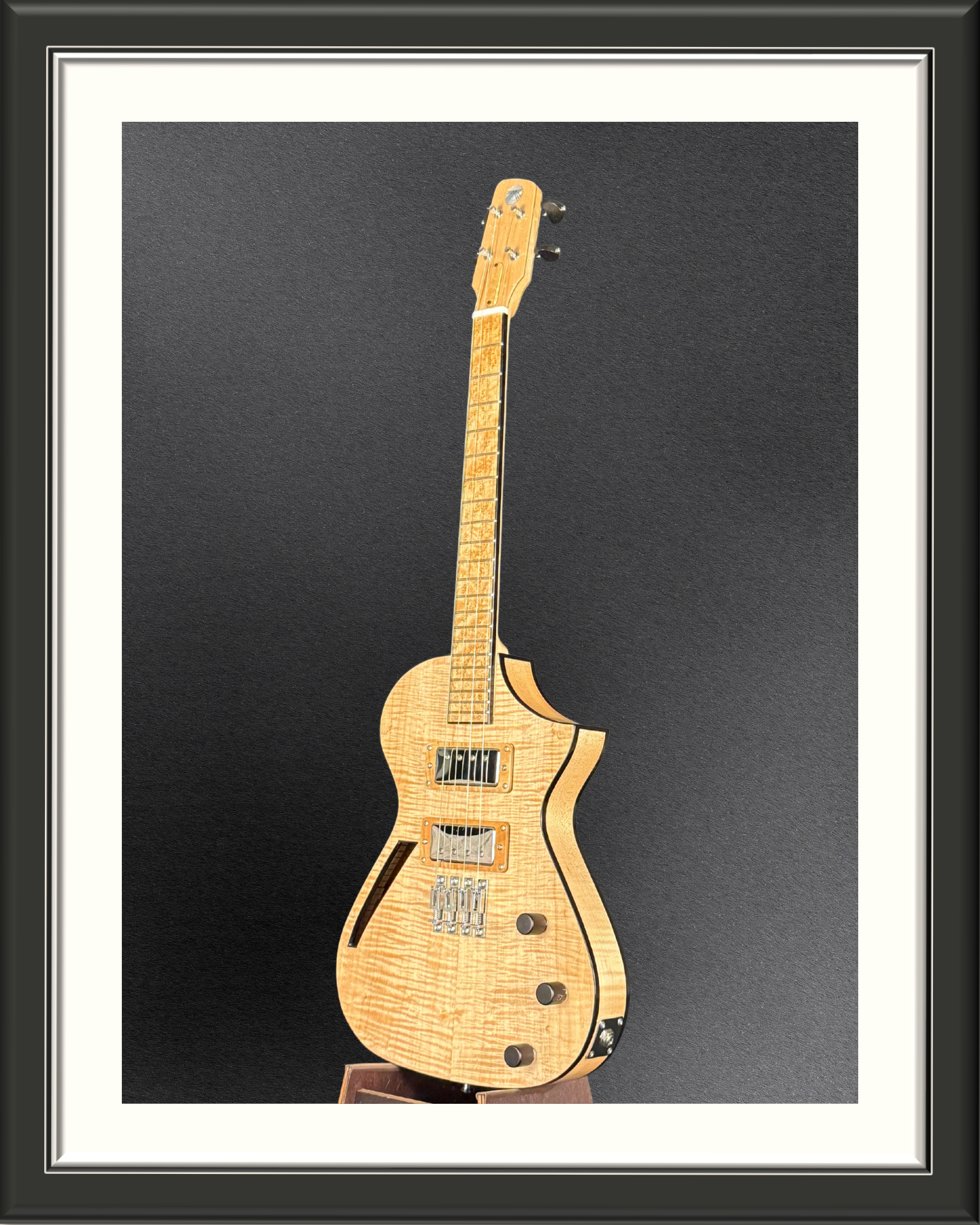 Front angle of the MachMachines Cuyler Model all-maple, hollow-body, electric baritone ukulele