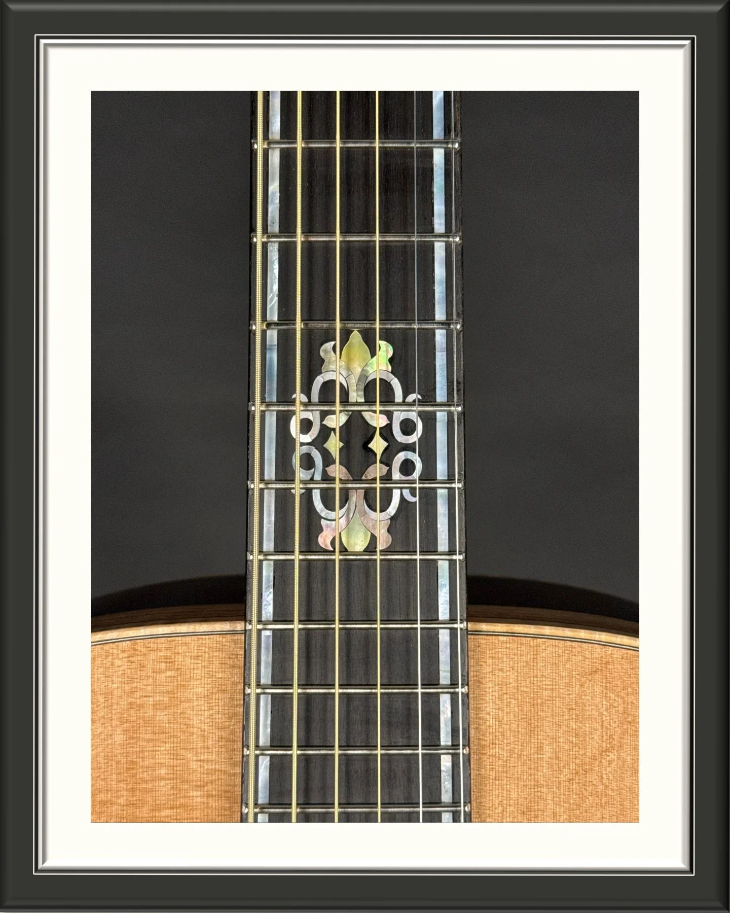 Close up of the custom inlay at the 12th fret that was inspired by art nouveau stained glass in transom windows