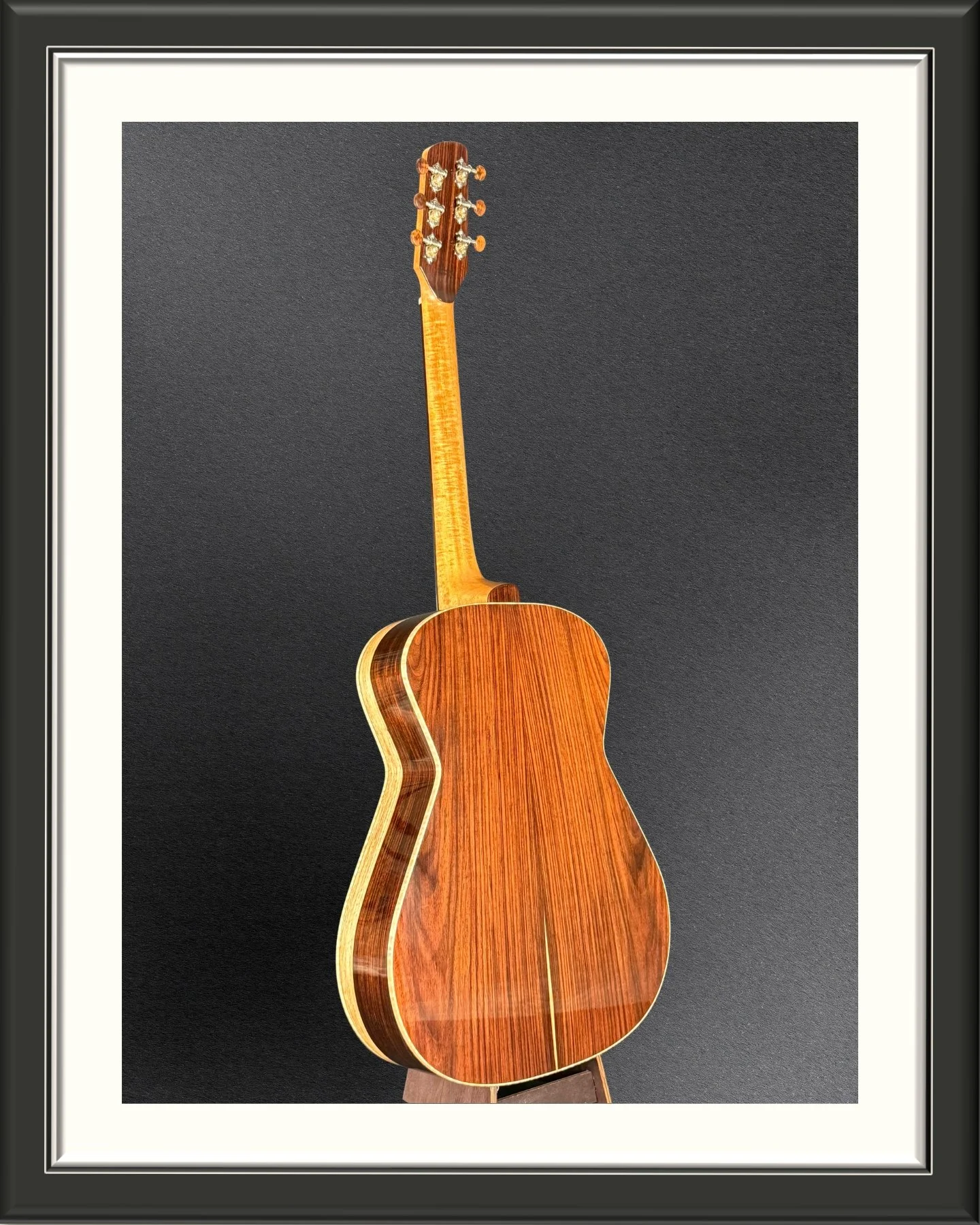 Full image of the back of the ECA custom acoustic guitar with Nicaraguan Rosewood back and sides, facing to the right