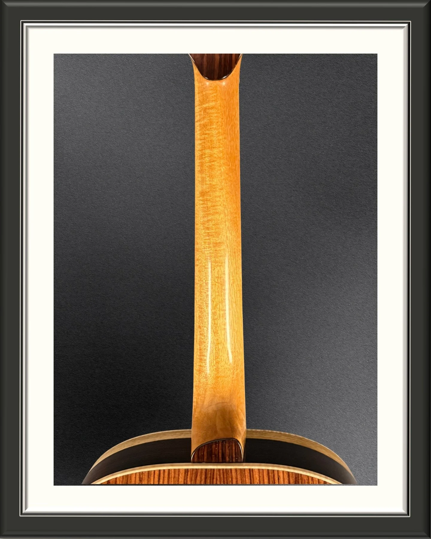 The neck of the ECA custom acoustic guitar in Honduran Mahogany