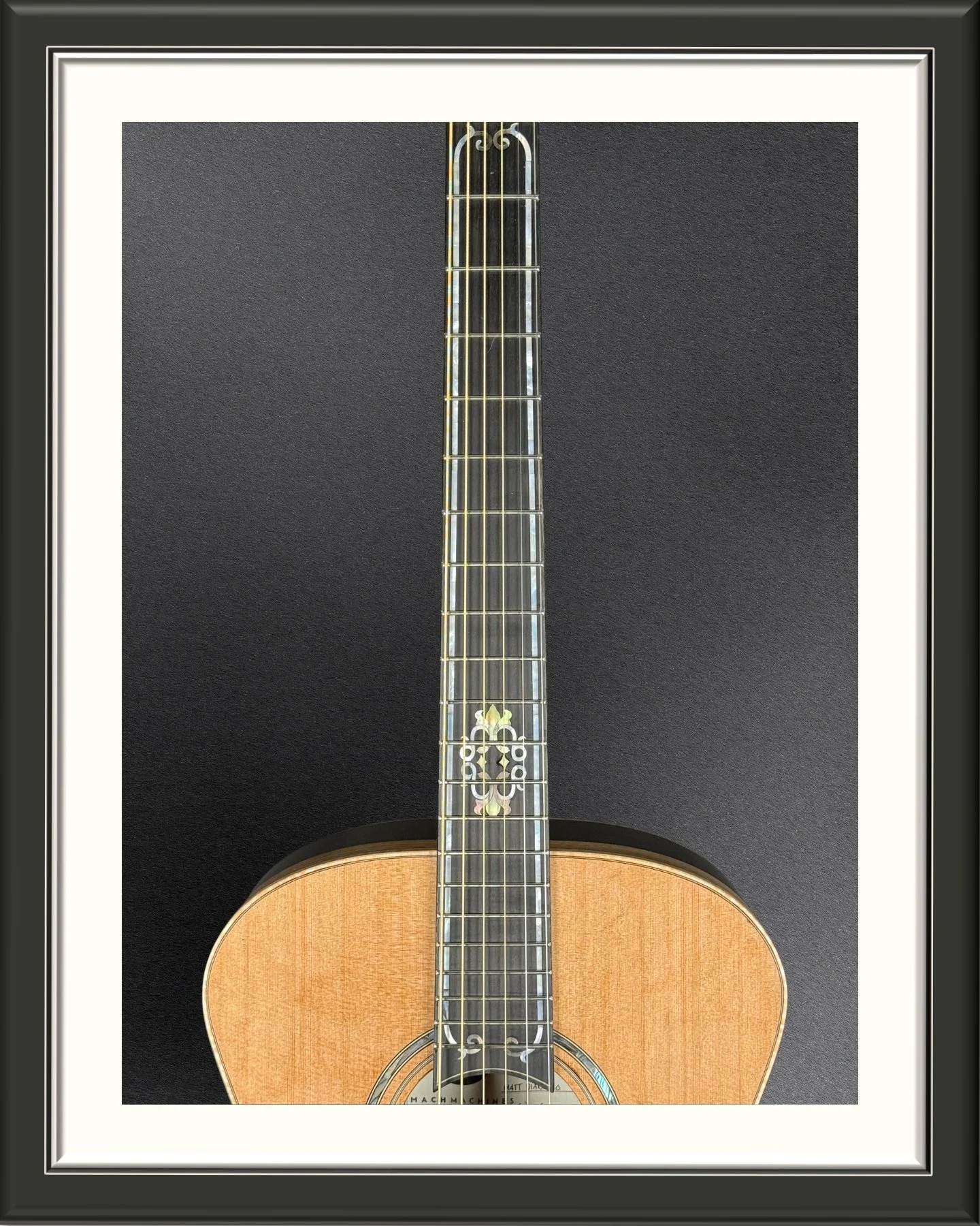 The fretboard of the ECA acoustic guitar with custom inlay inspired by the art nouveau stained glass in transom windows