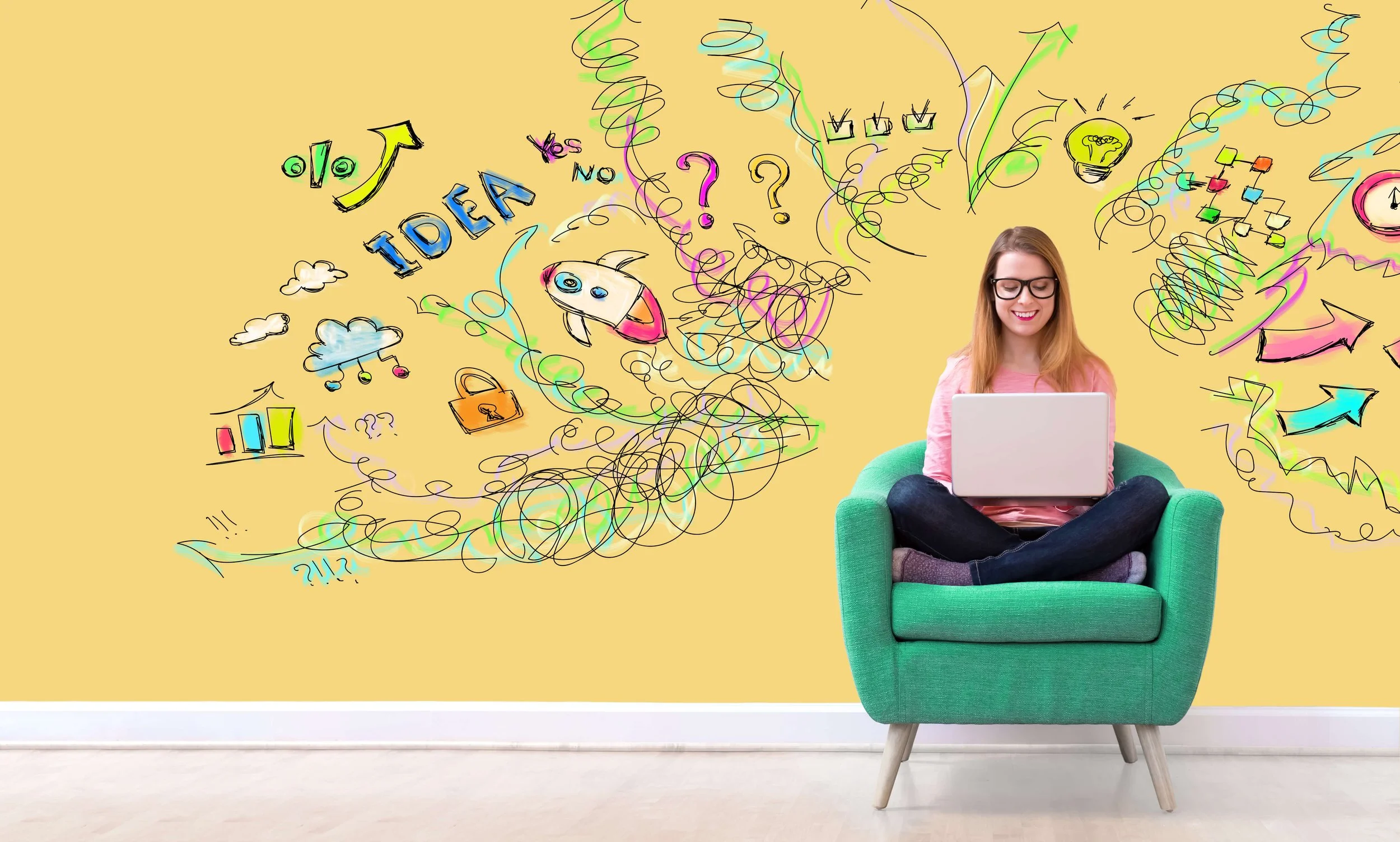 Woman on a laptop with lots of doodled ideas on a yellow background.