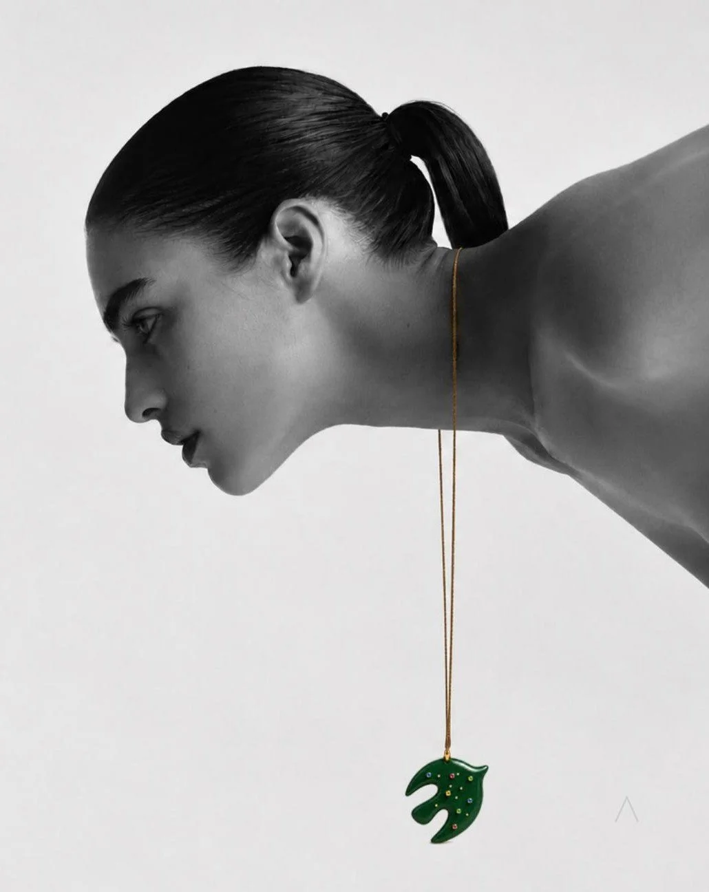 SKAI green sculptural pendant on a model