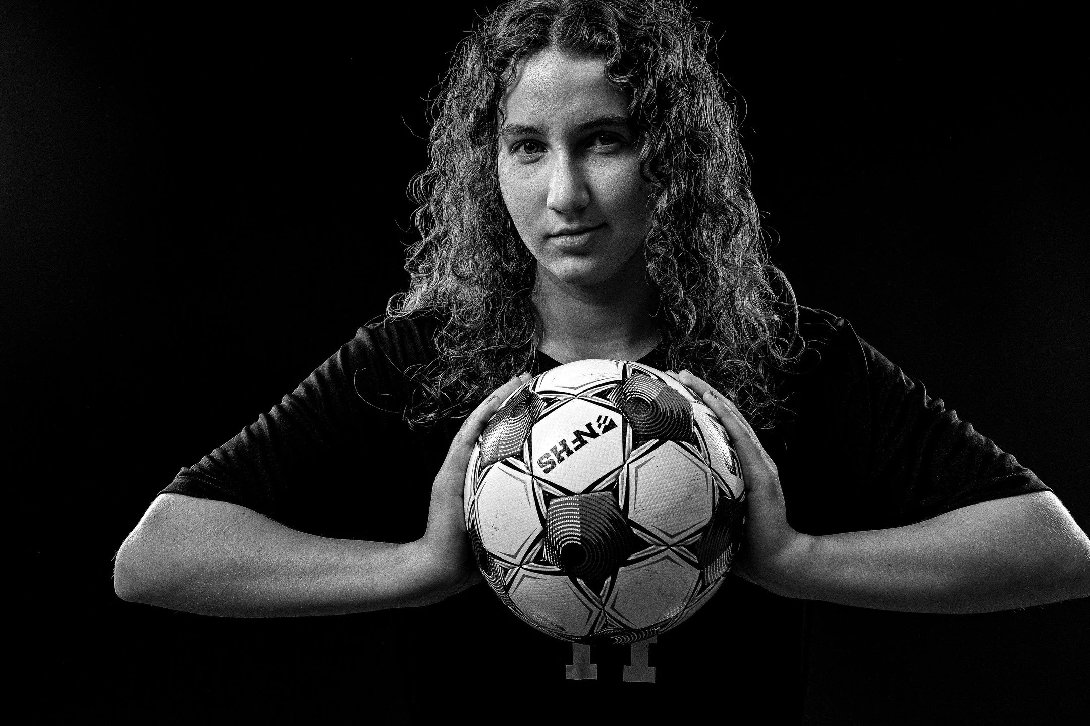 Tried something different with girls' soccer media day photos at school this week. The black-and-white, contrasty look is a bit different but came out well. Lights @flashpointlighting shot on @nikonusa Z8. #Soccer #Football #Portraits #MediaDay #Flas