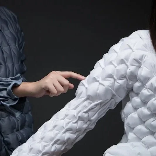 The Pneumatic Jacket and sweater  leverages on the formation of air-pockets to trap air, preventing air from being displaced and circulated by external factors. Moreover, these air-pocket segments create “joints” that facilitate movement; thus, break