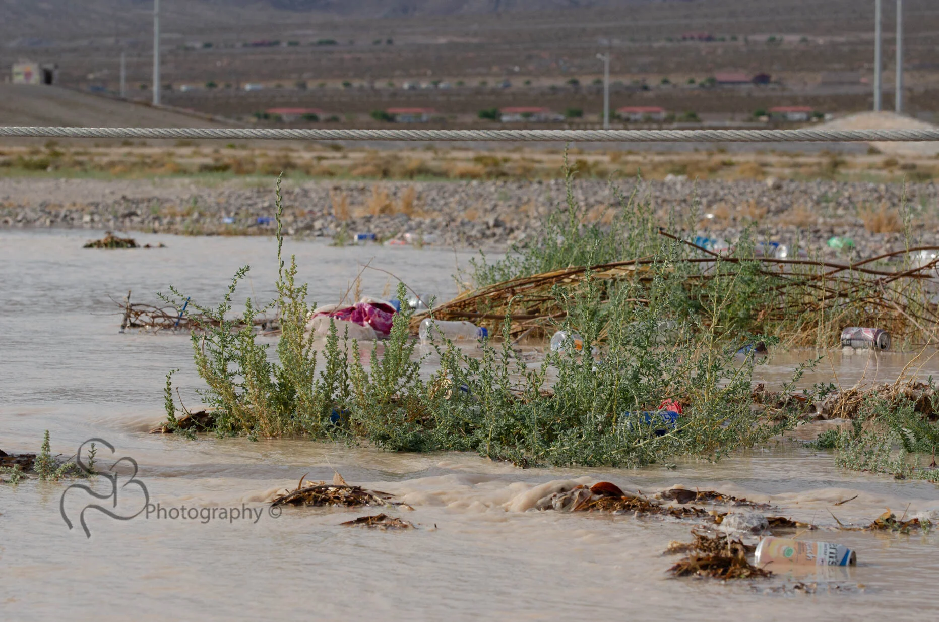 The washes around Las Vegas start to fill after just a little rainfall in the desert, often clearing trash and other things discarded in the desert. © 2016 Shannon Beelman 