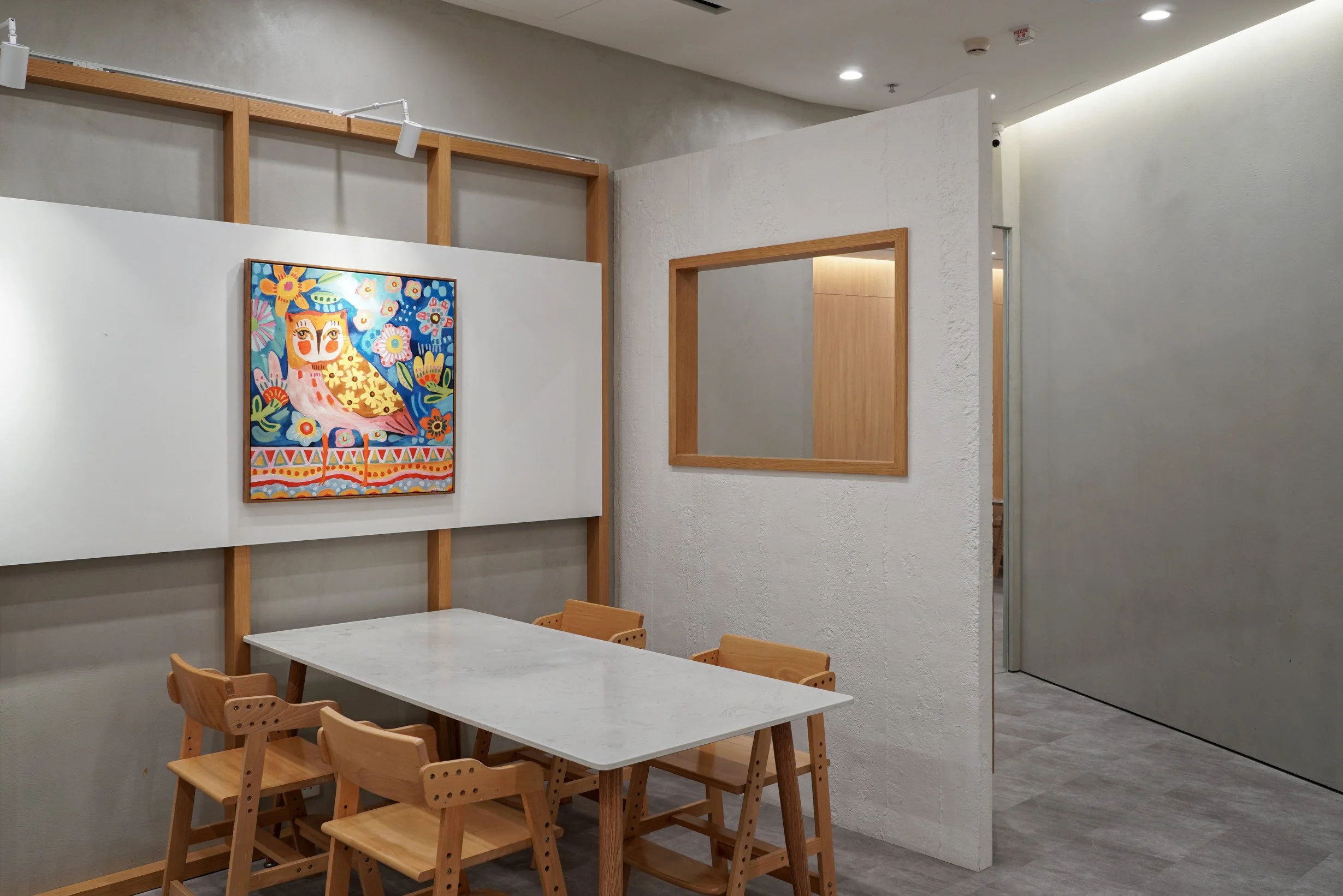 Rectangular timber frames defining the reception and teaching areas at The White Box