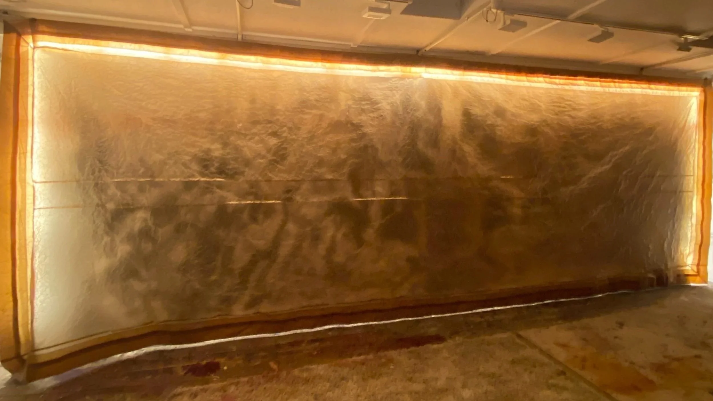 ‘Because I Can Forget,’ Kate Howe, 2025. Waxed Kraft Paper, stitching, lights, sumi ink painting after Rubens direct on the wall. 6.6 x 2.2 m. Installation View