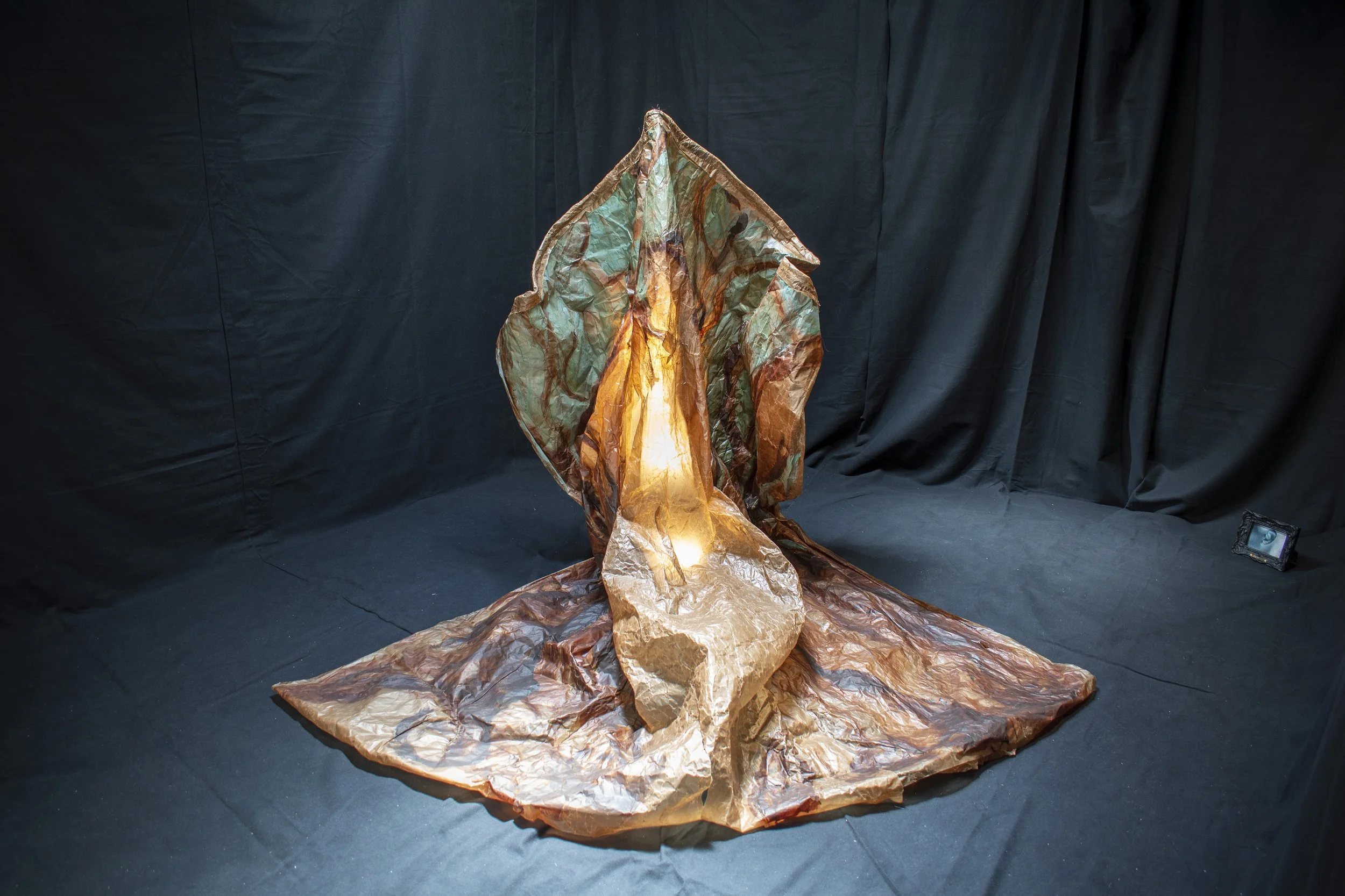 ‘I felt it brush my forearms as it fell, keeps falling, over and over. The sun, I notice, is very blue, coming through the leaves. (After Gentileschi with Memory totemic)’, Kate Howe, 2022, installation, oil paint and stitching on Kraft paper in blac