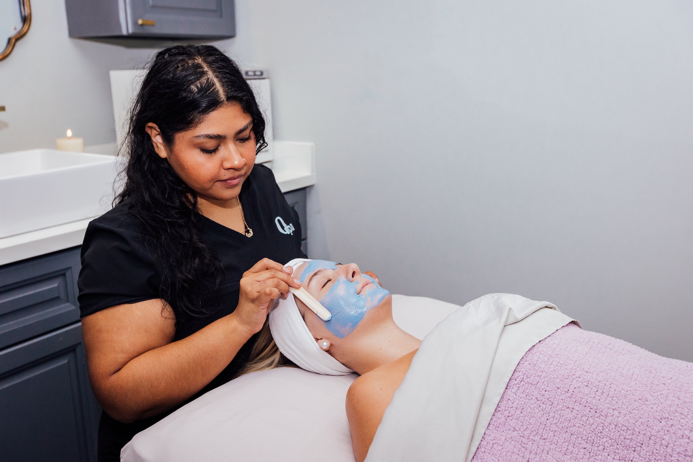 Woman gets facial at O Spa