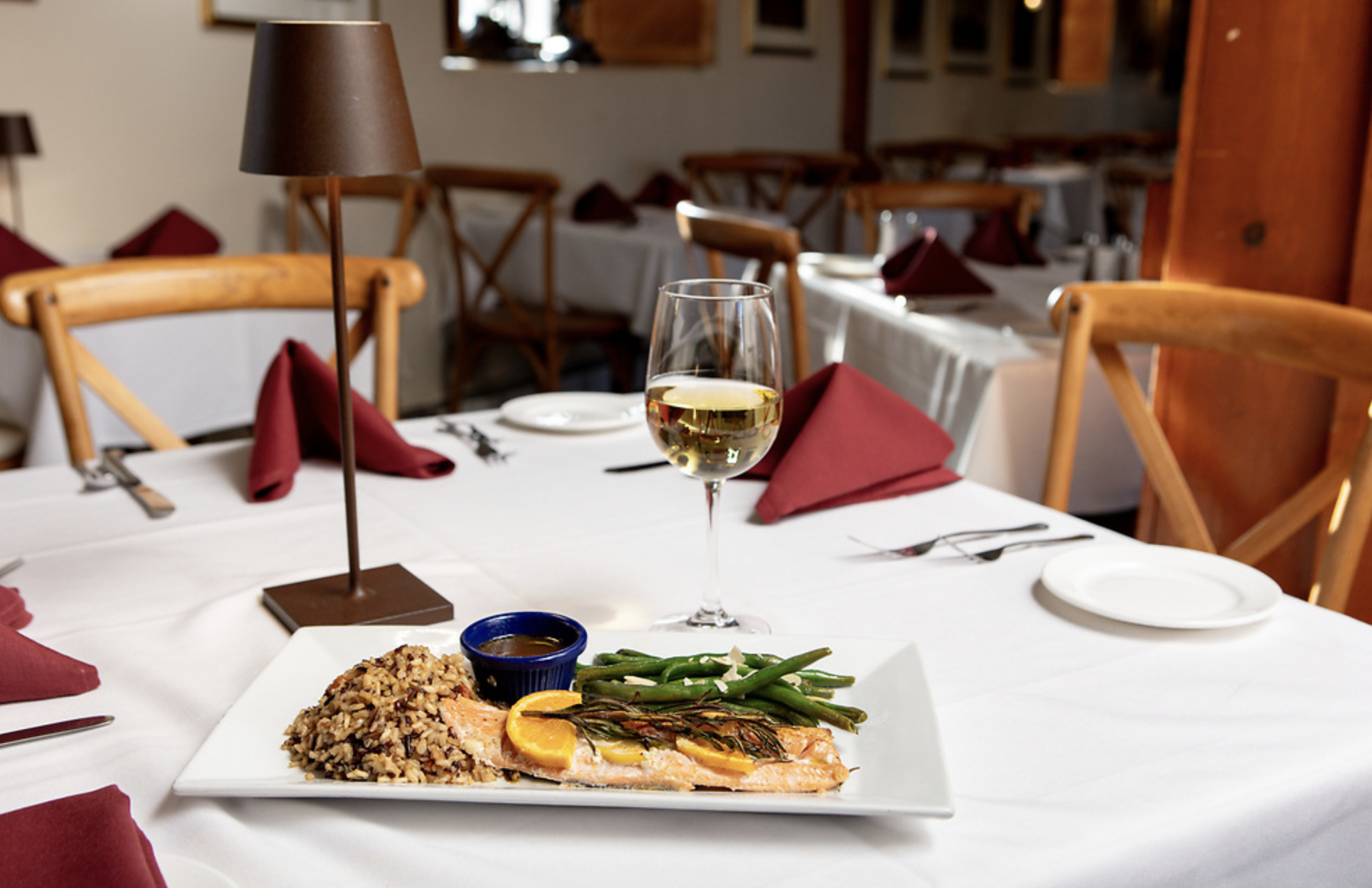 Salmon and asparagus on table with wine
